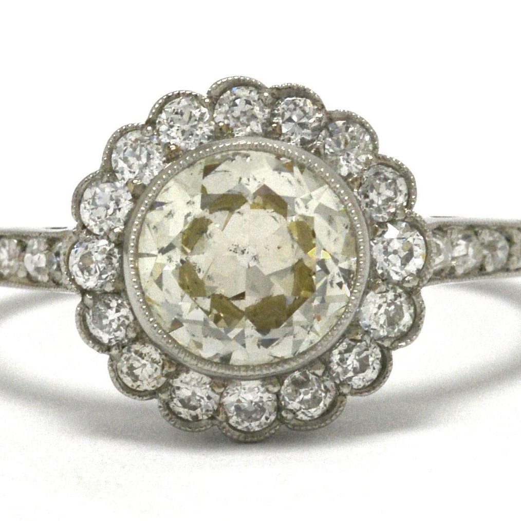 An Edwardian inspired diamond cluster engagement ring.