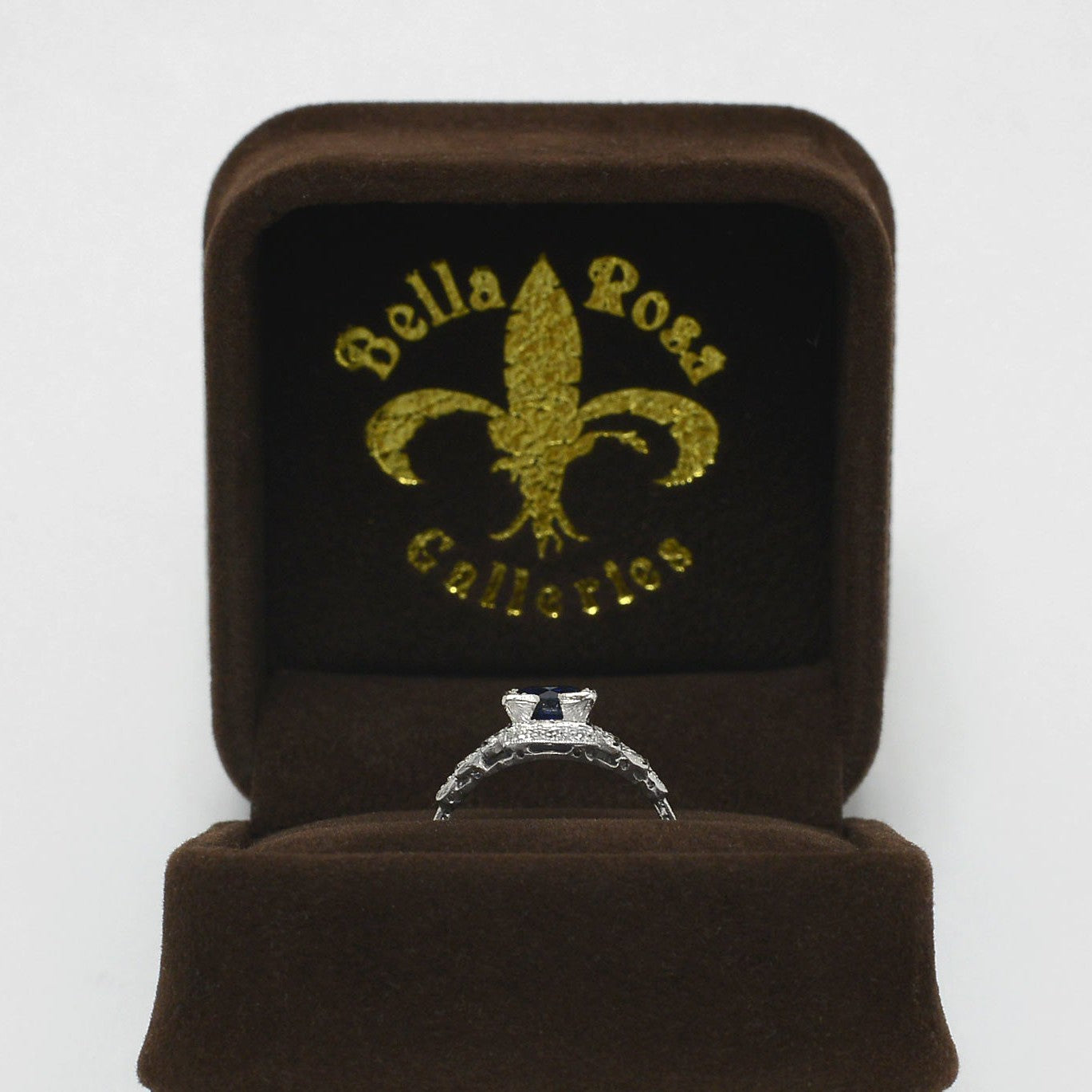 A one carat round faceted sapphire, antique engagement ring.