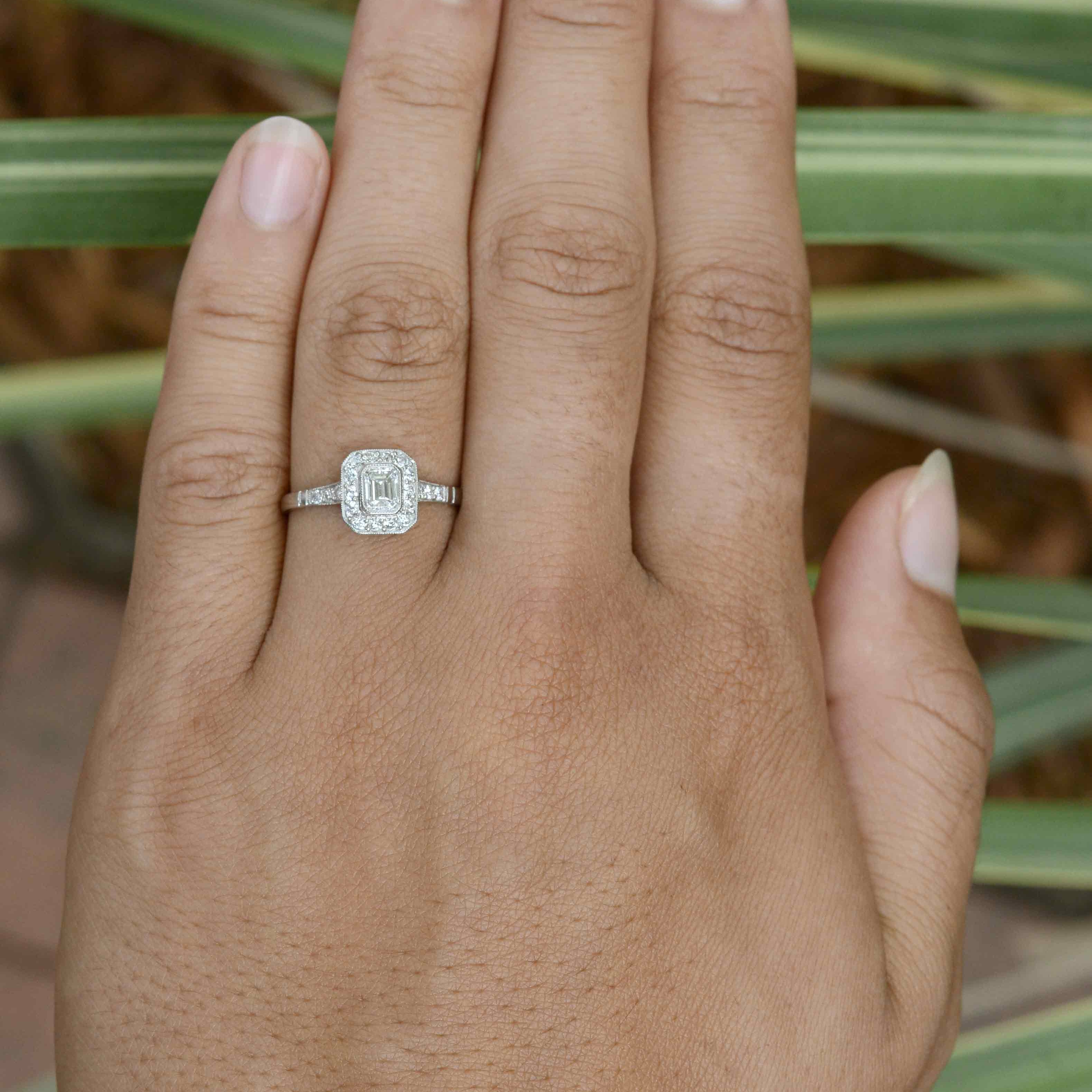 A rounded square platinum Art Deco engagement ring design.