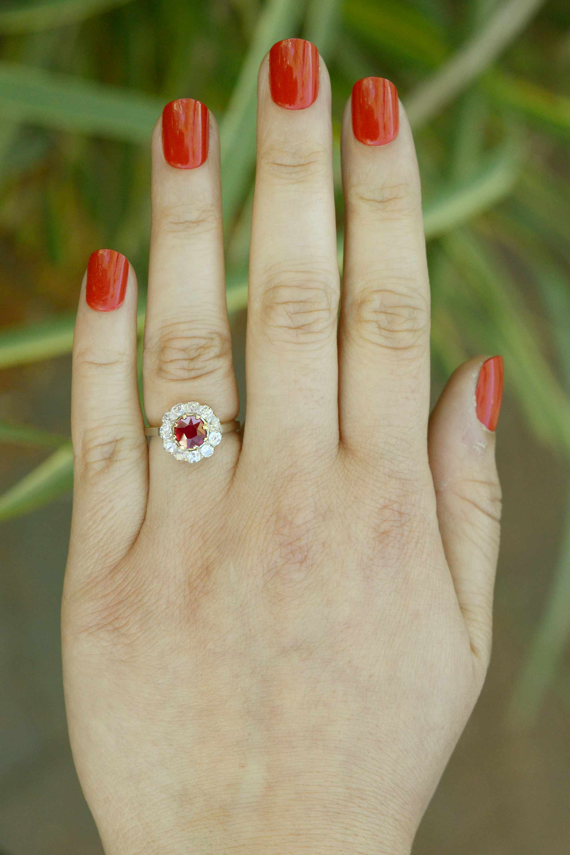 A unique size 5 platinum ruby engagement ring with an 18k gold center setting.