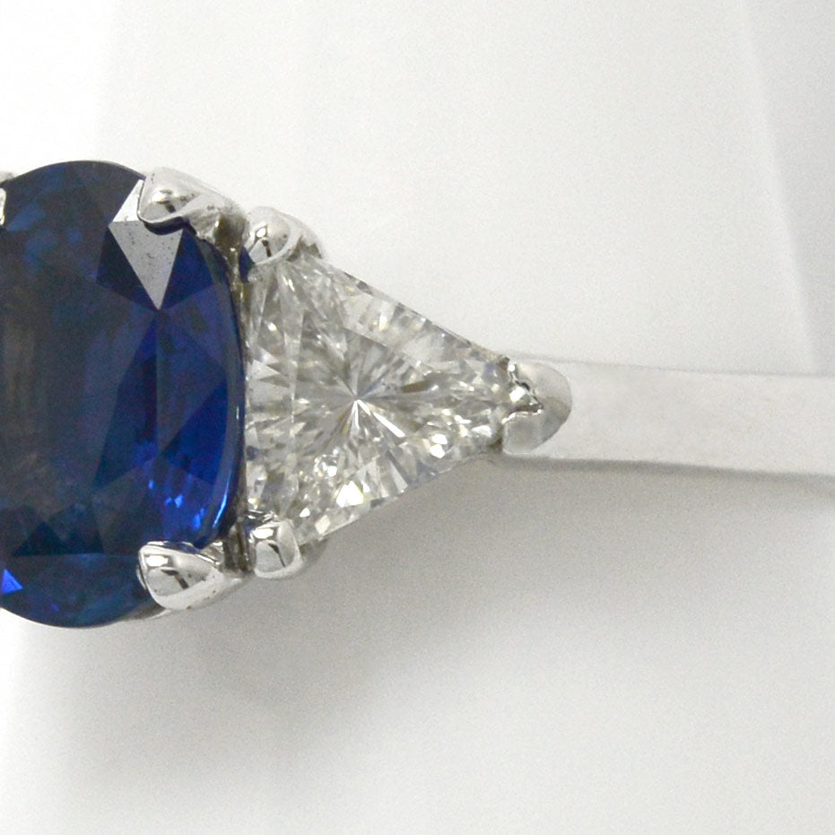 1.50 carats of trillion cut diamonds support this large ceylon sapphire engagement ring.