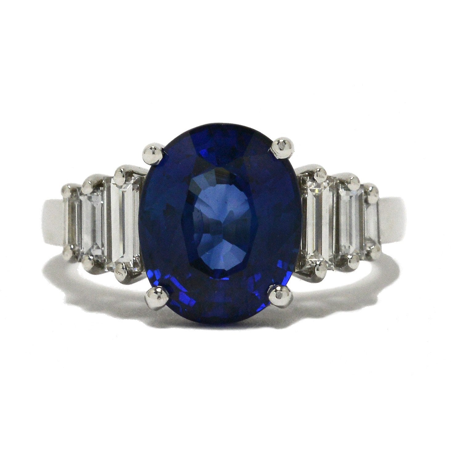 An Art Deco revival engagement ring featuring a large, 4 carat oval blue sapphire.