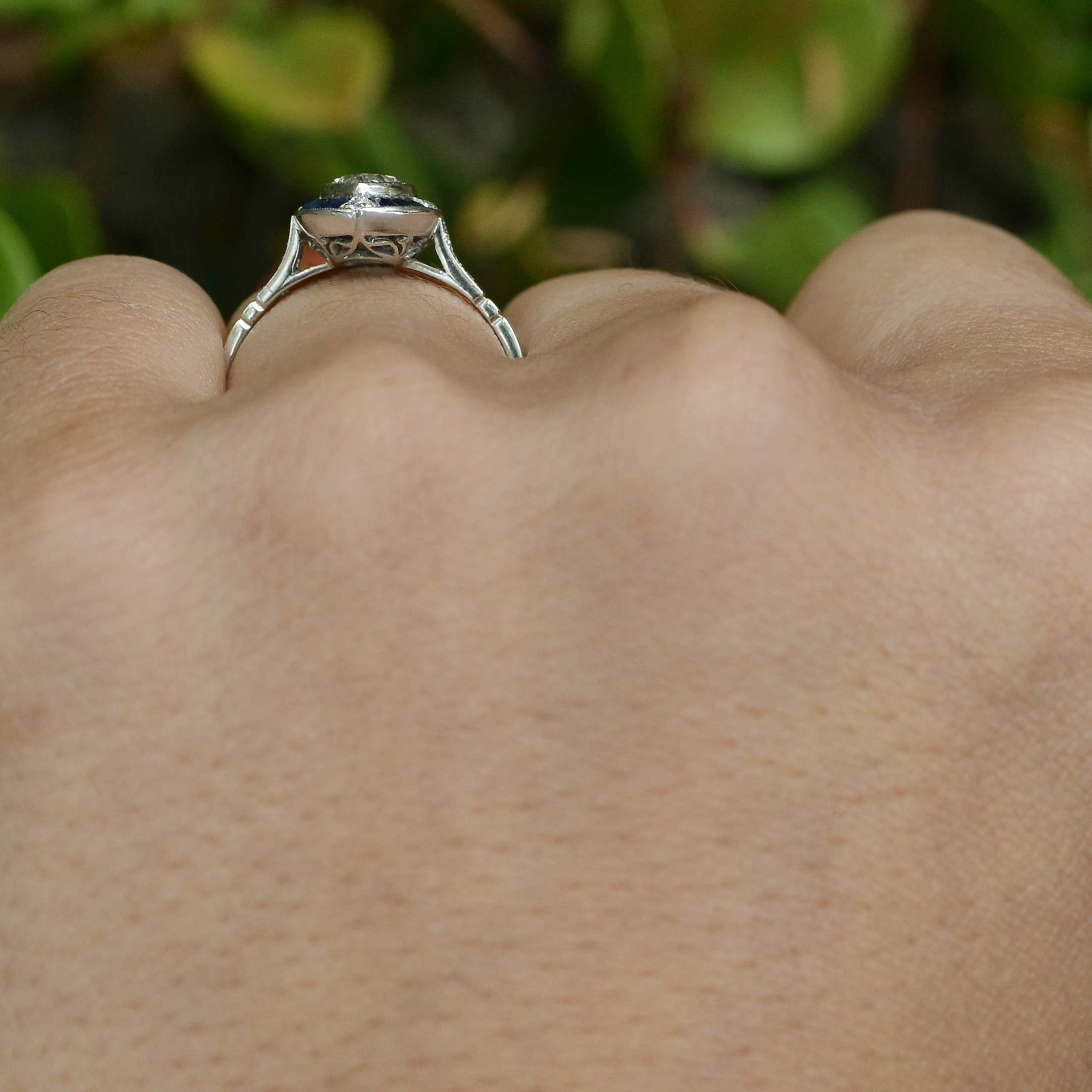A platinum filigree undergallery is crafted in this Art Deco engagement ring.
