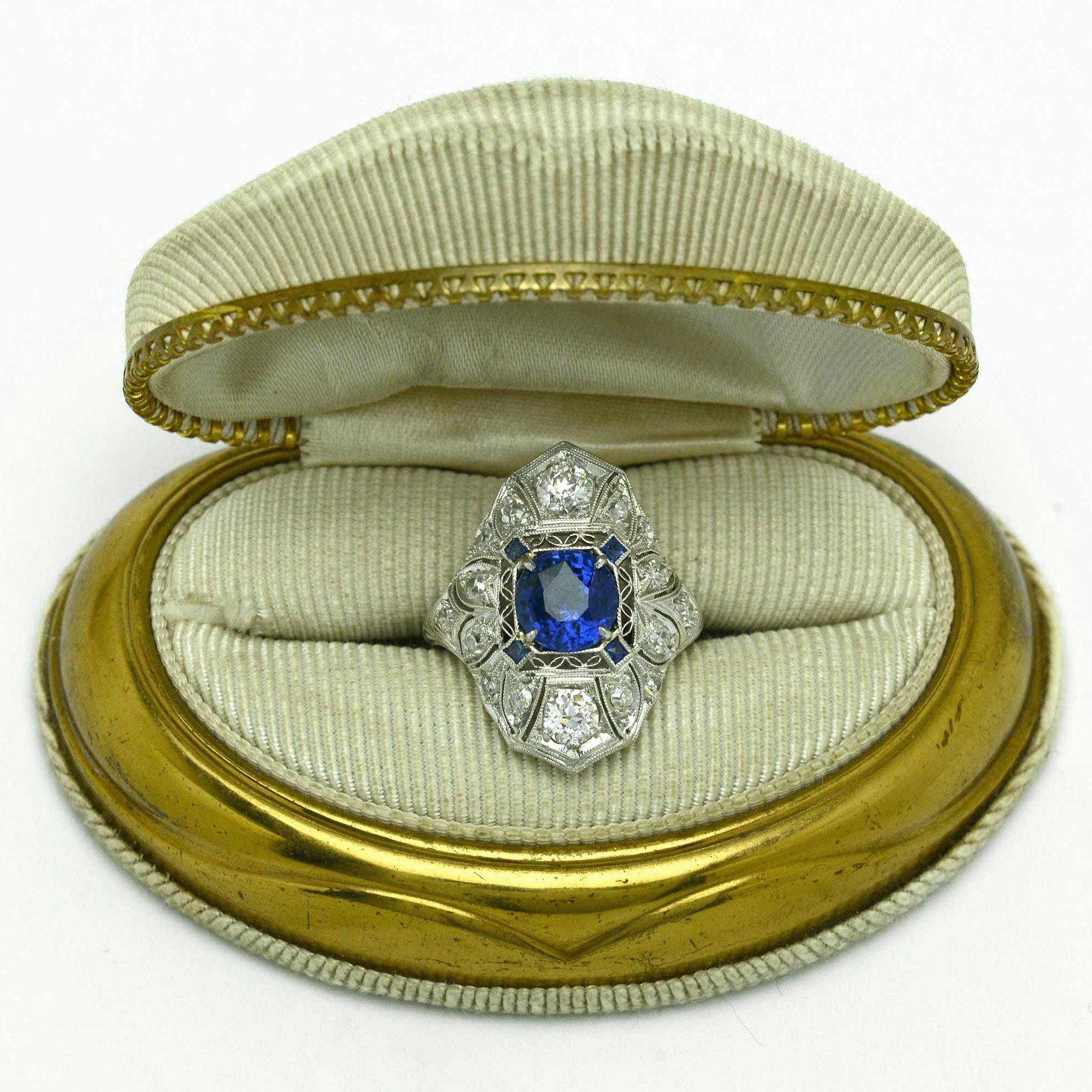An Edwardian sapphire engagement ring from the early 1900s in a presentation box.