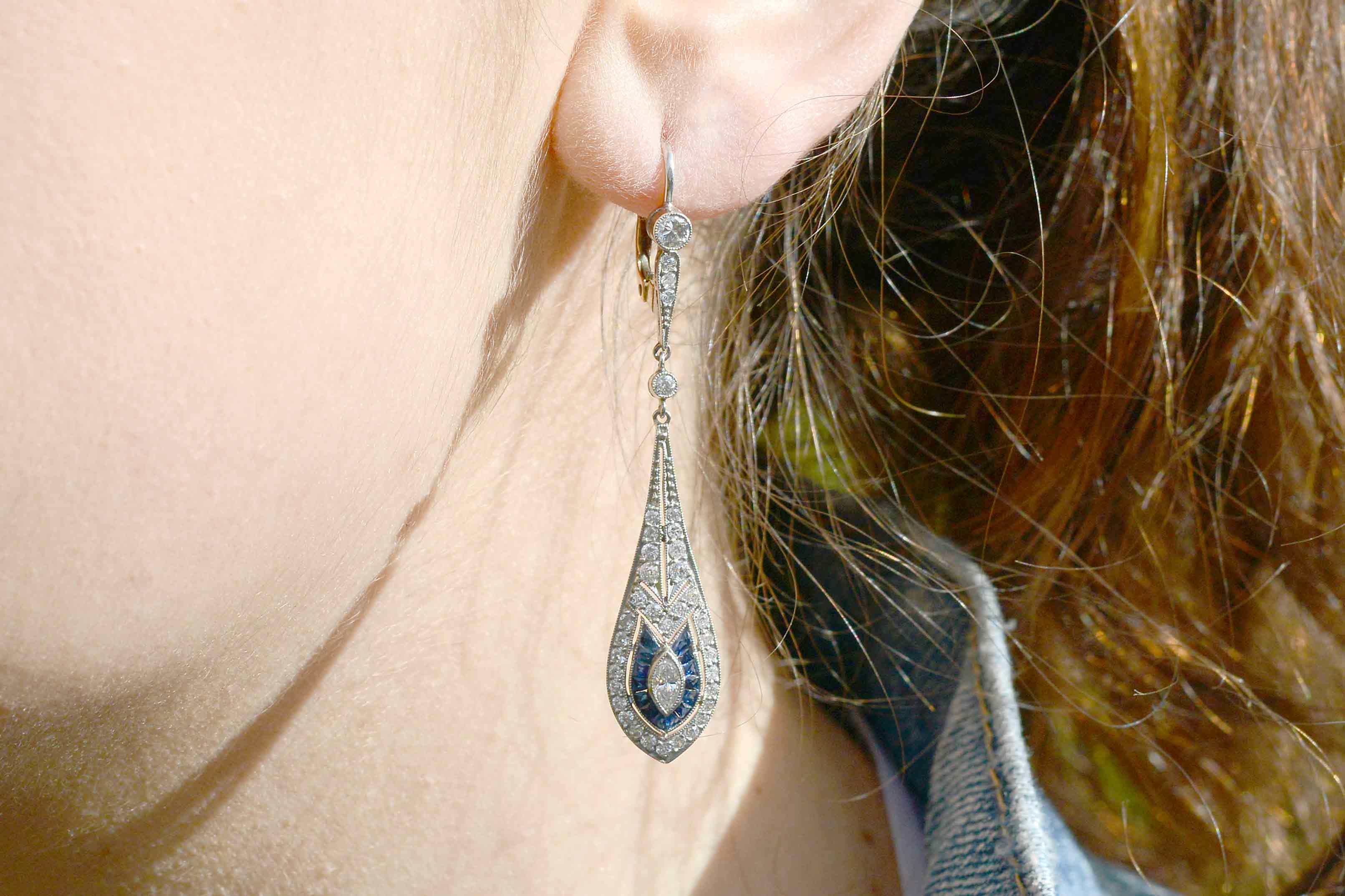 Platinum and gold leverback earrings with over 2 carats of diamonds and sapphires.