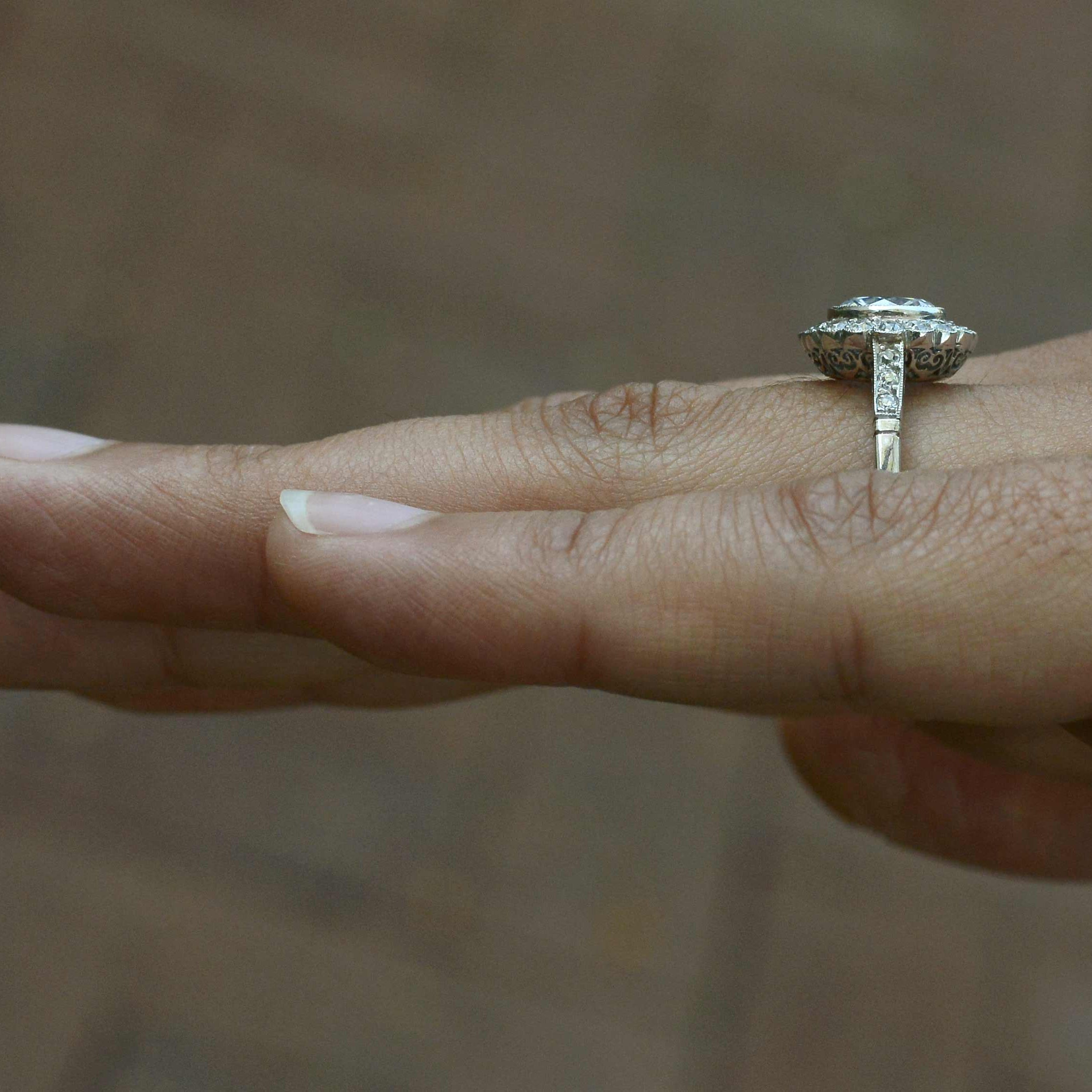 A durable floral diamond halo engagement ring.