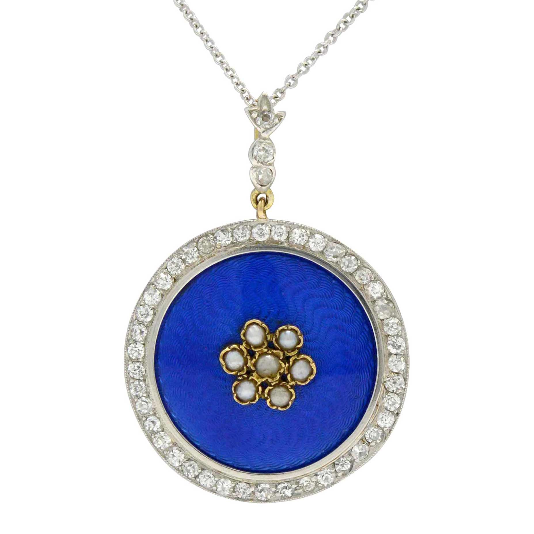 This blue enamel pendant has a motif of dainty seed pearls and blue enamel.