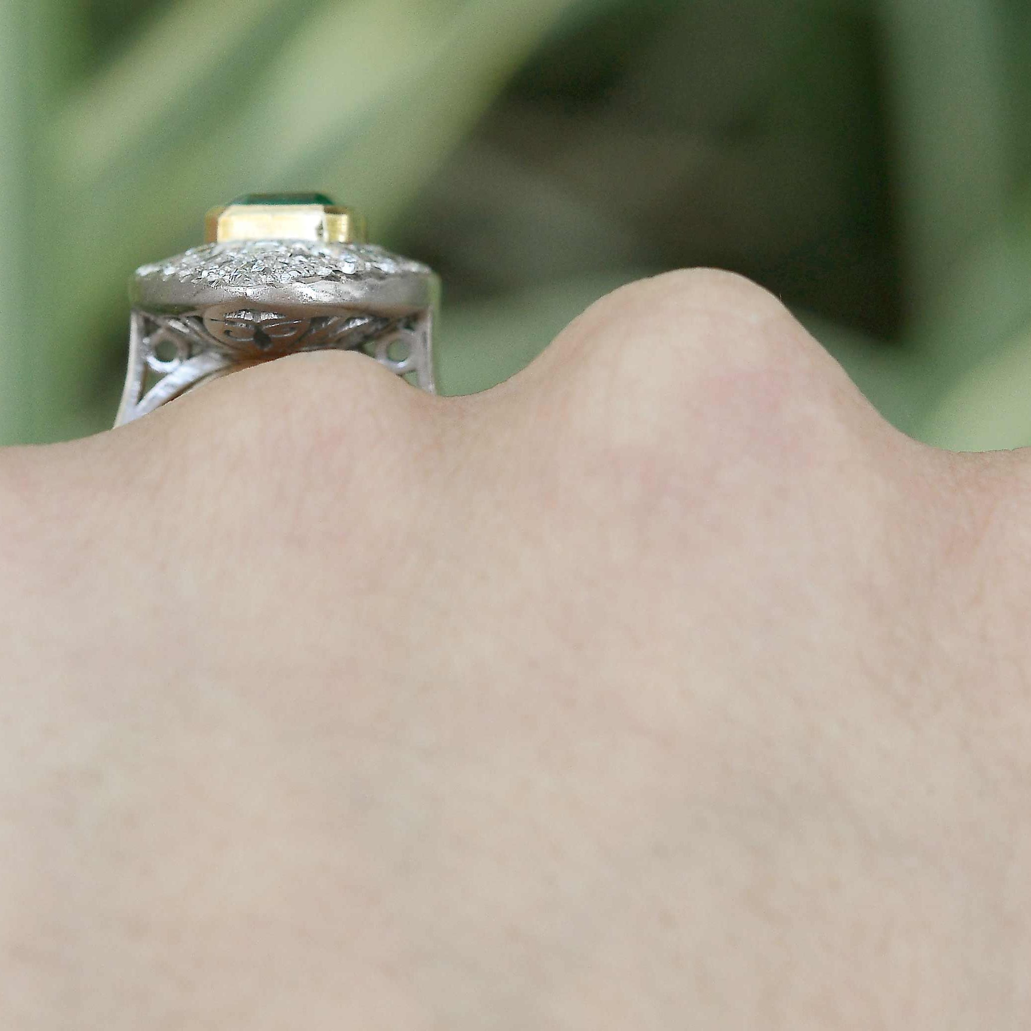 An 18k gold bezel supports the large 2 carat emerald from Colombia.