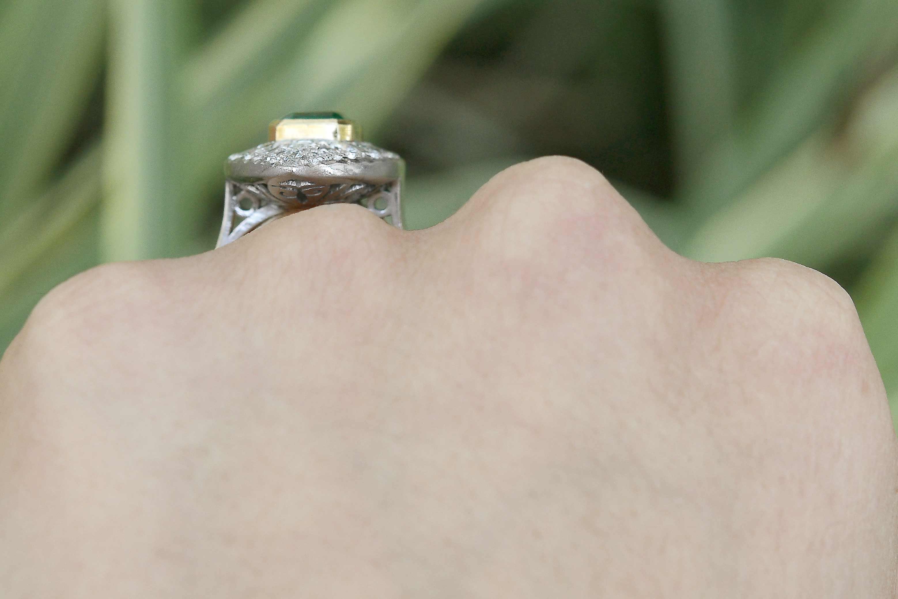 An 18k gold bezel supports the large 2 carat emerald from Colombia.