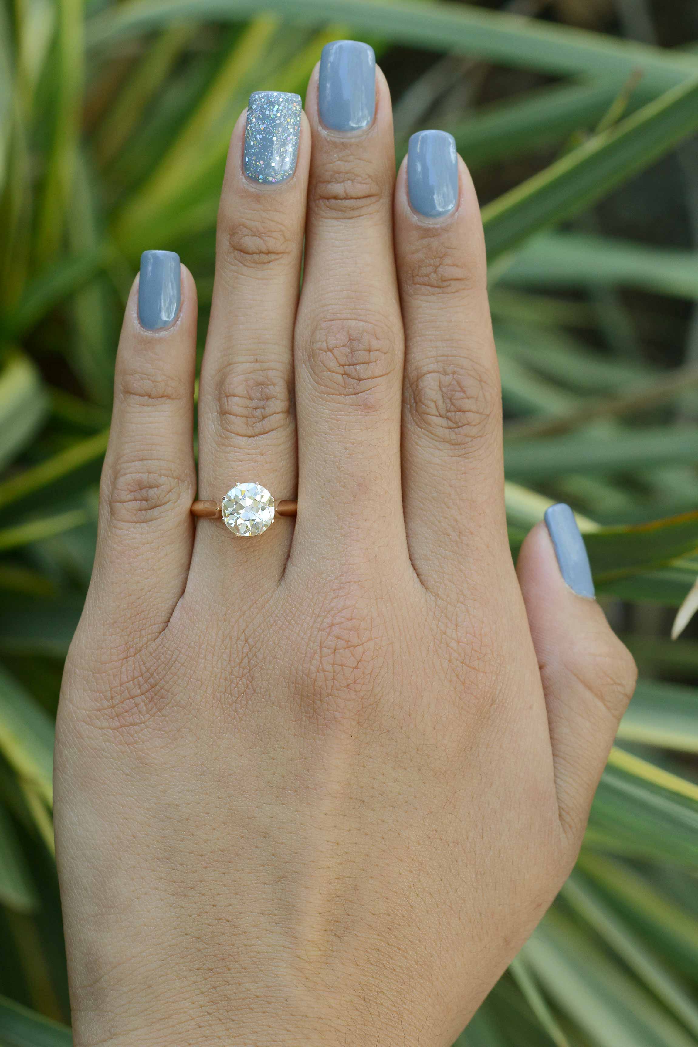 A nearly 3 carats old mine diamond, 18k rose gold solitaire wedding ring.