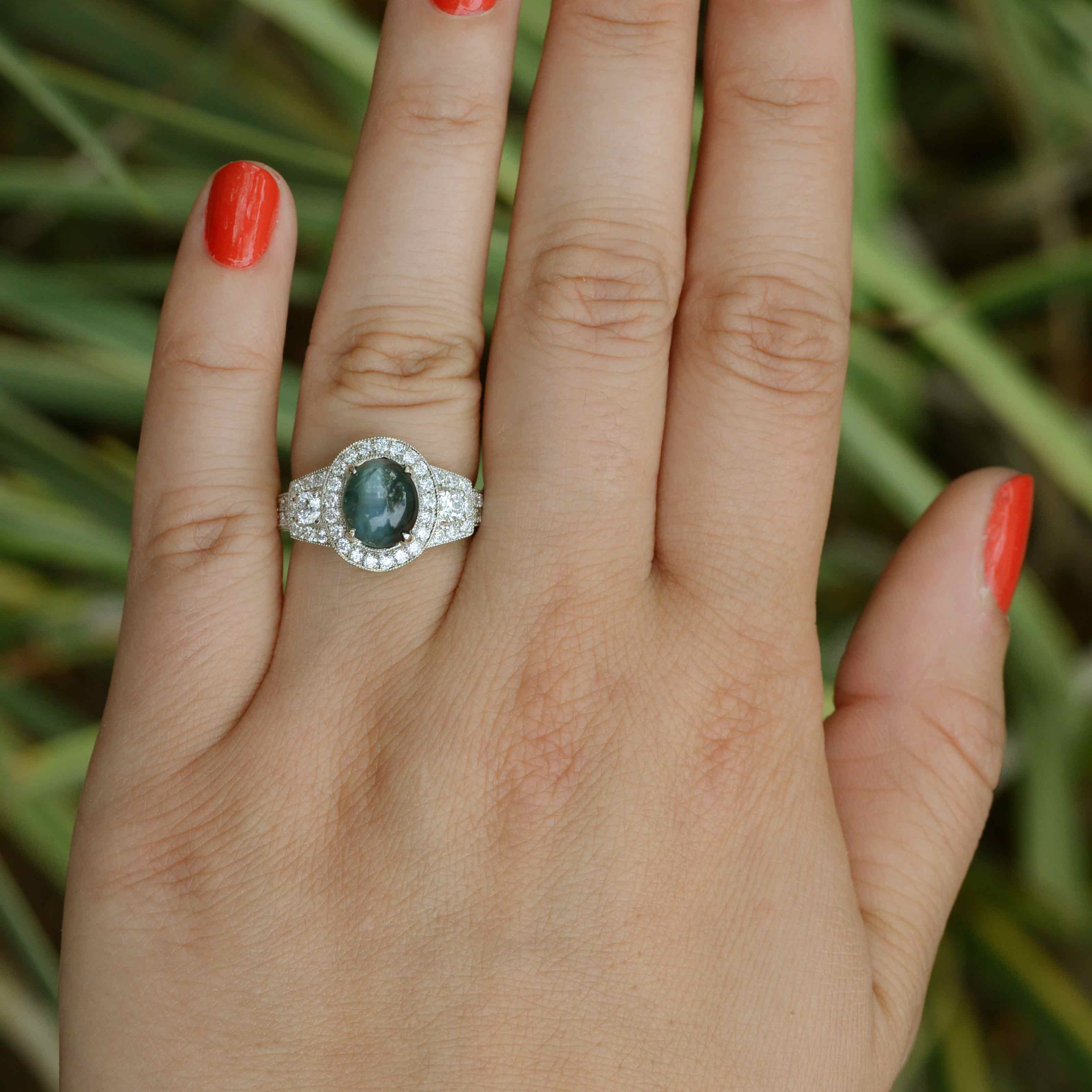 A unique cat's eye alexandrite and diamond target engagement ring.