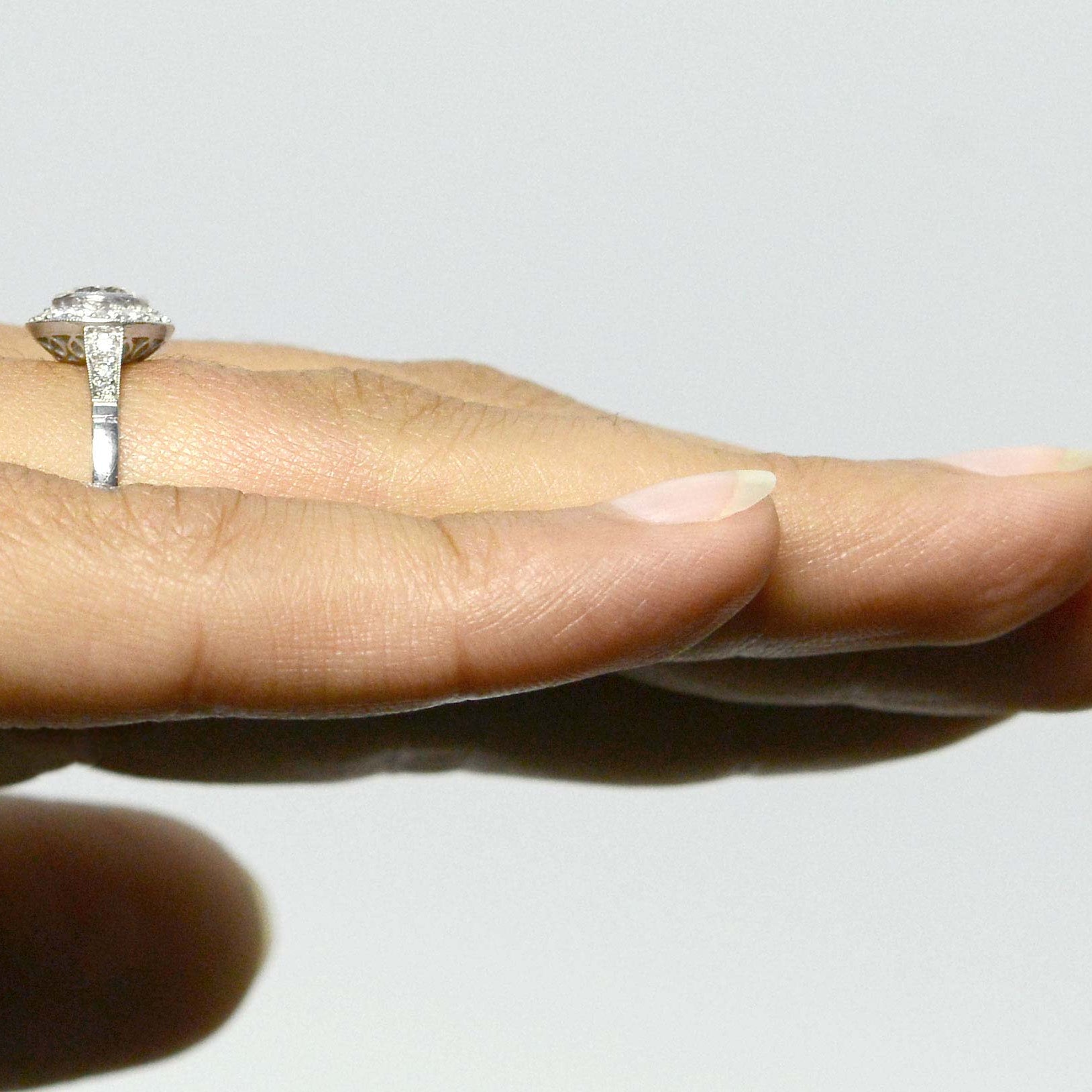 A size 7 and a quarter, diamonds halo engagement ring.