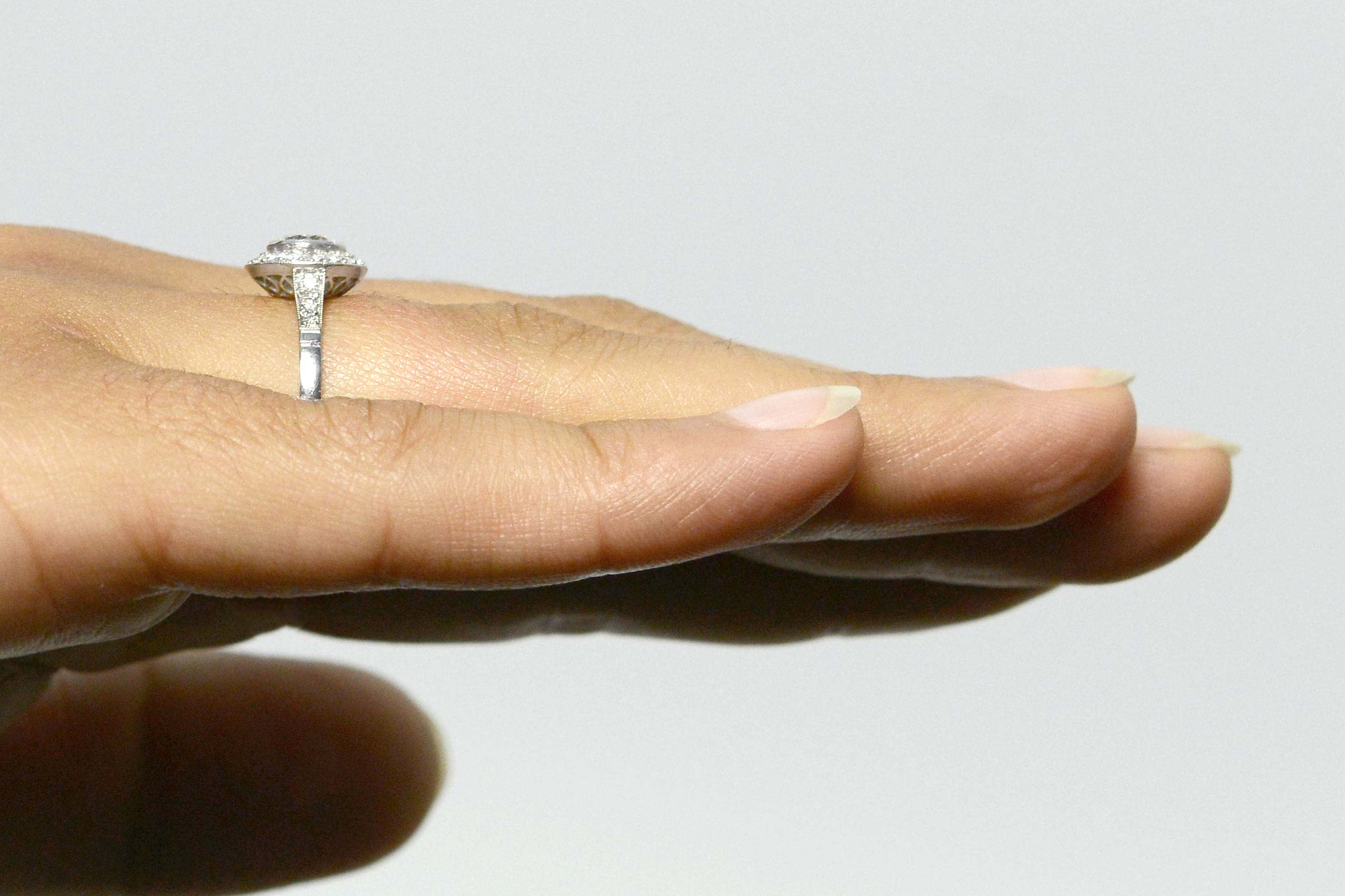 A size 7 and a quarter, diamonds halo engagement ring.