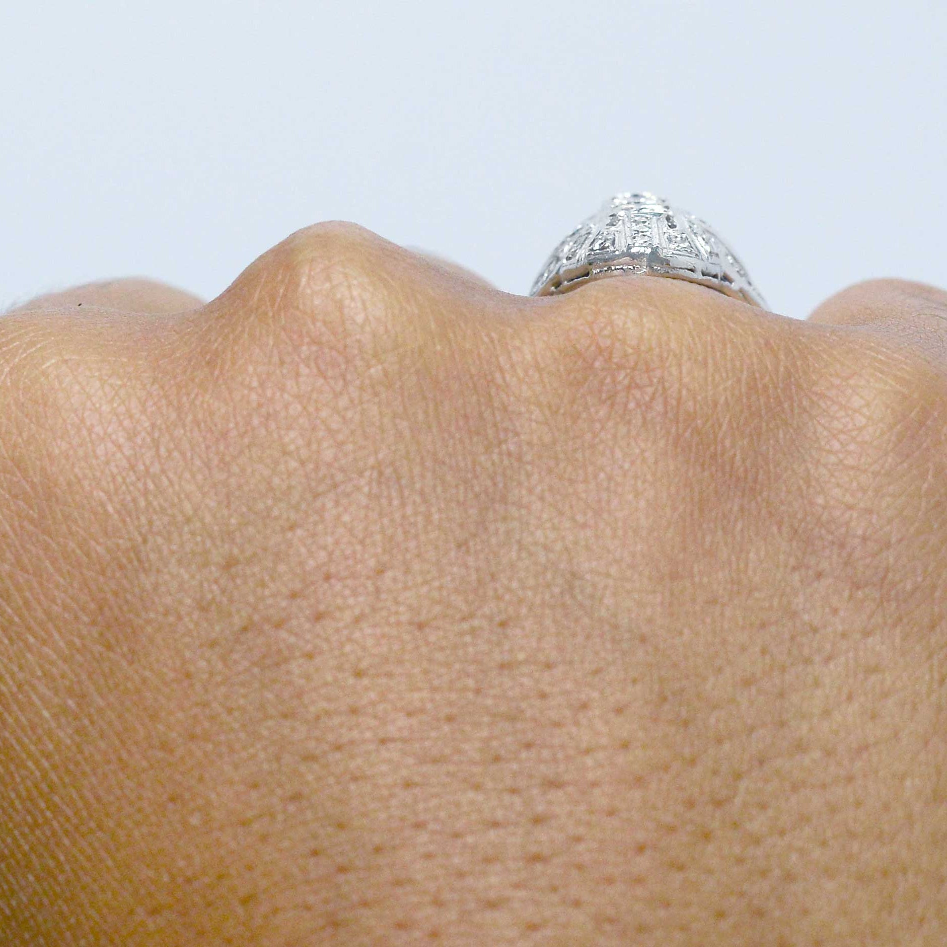 Filigree diamonds shield ring.