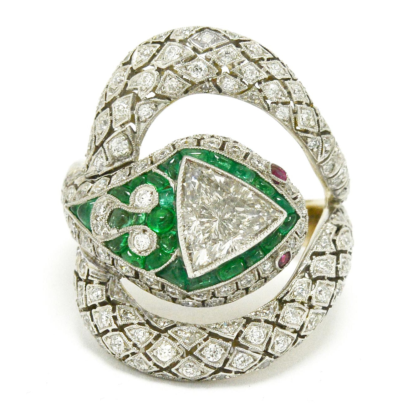 1 carat trillion cut diamond snake ring with emeralds and rubies.