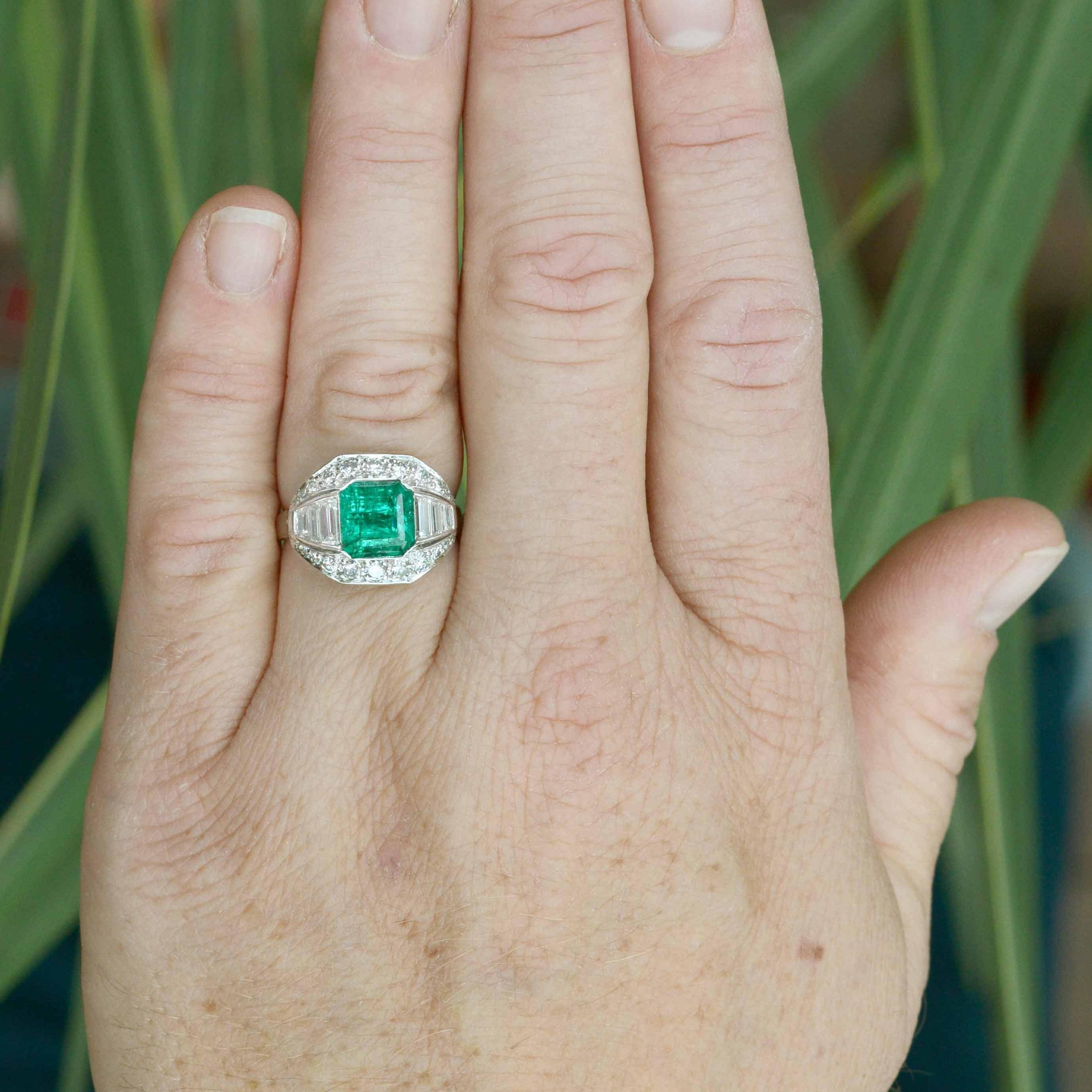 An Art Deco statement ring with a square emerald, accented by diamonds.
