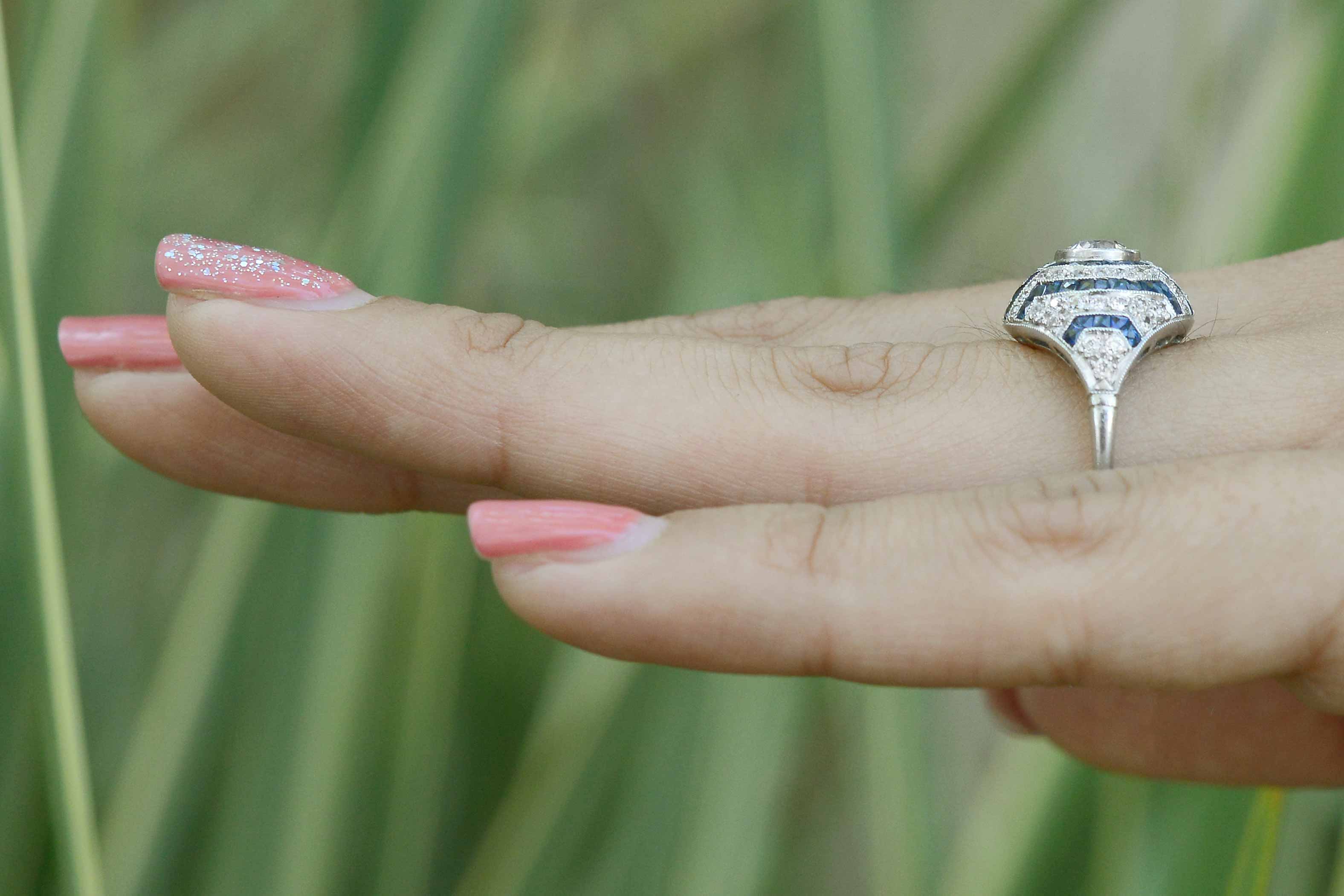 A 2mm band supports this geometric striped design Art Deco ring.