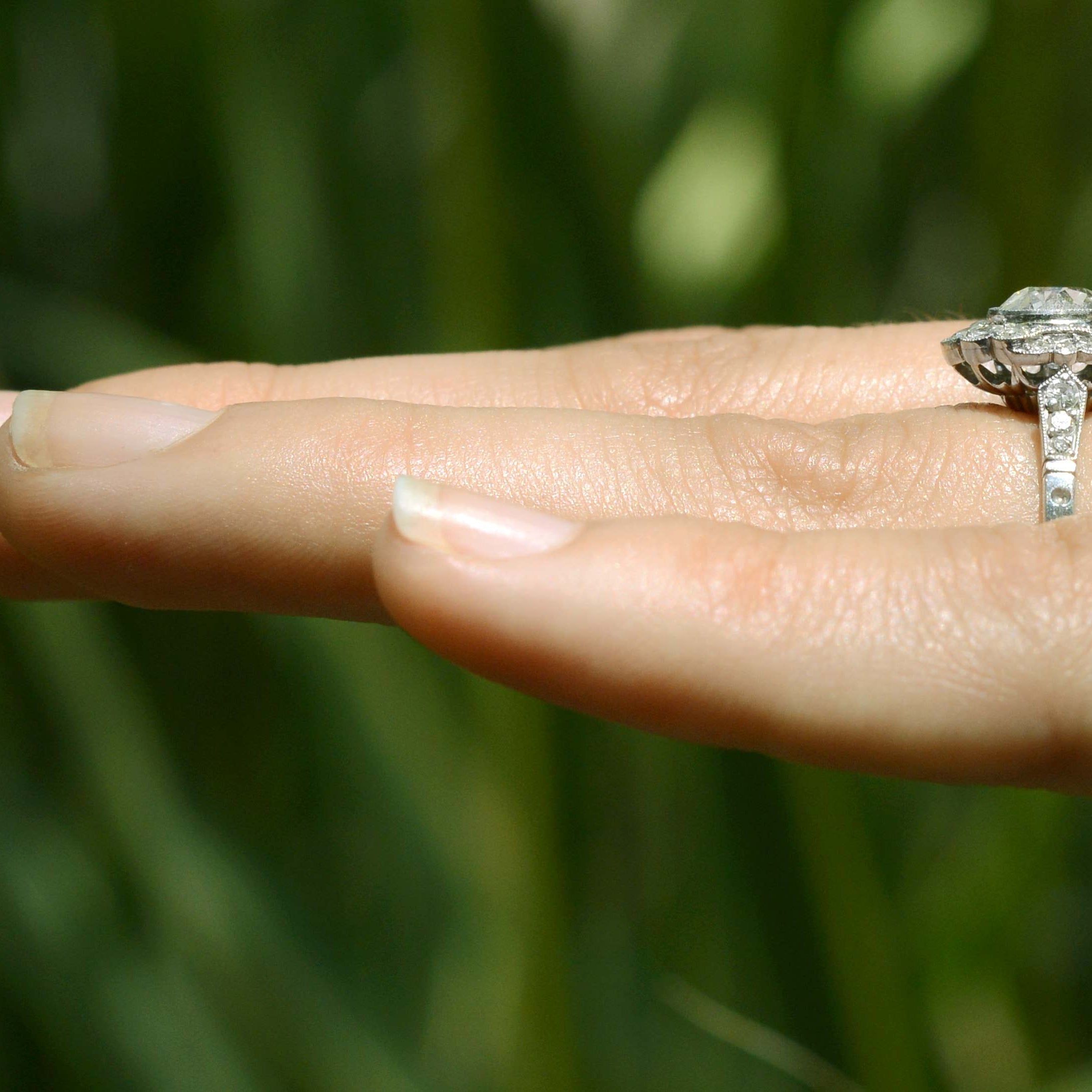 This engagement ring has diamonds on the band.
