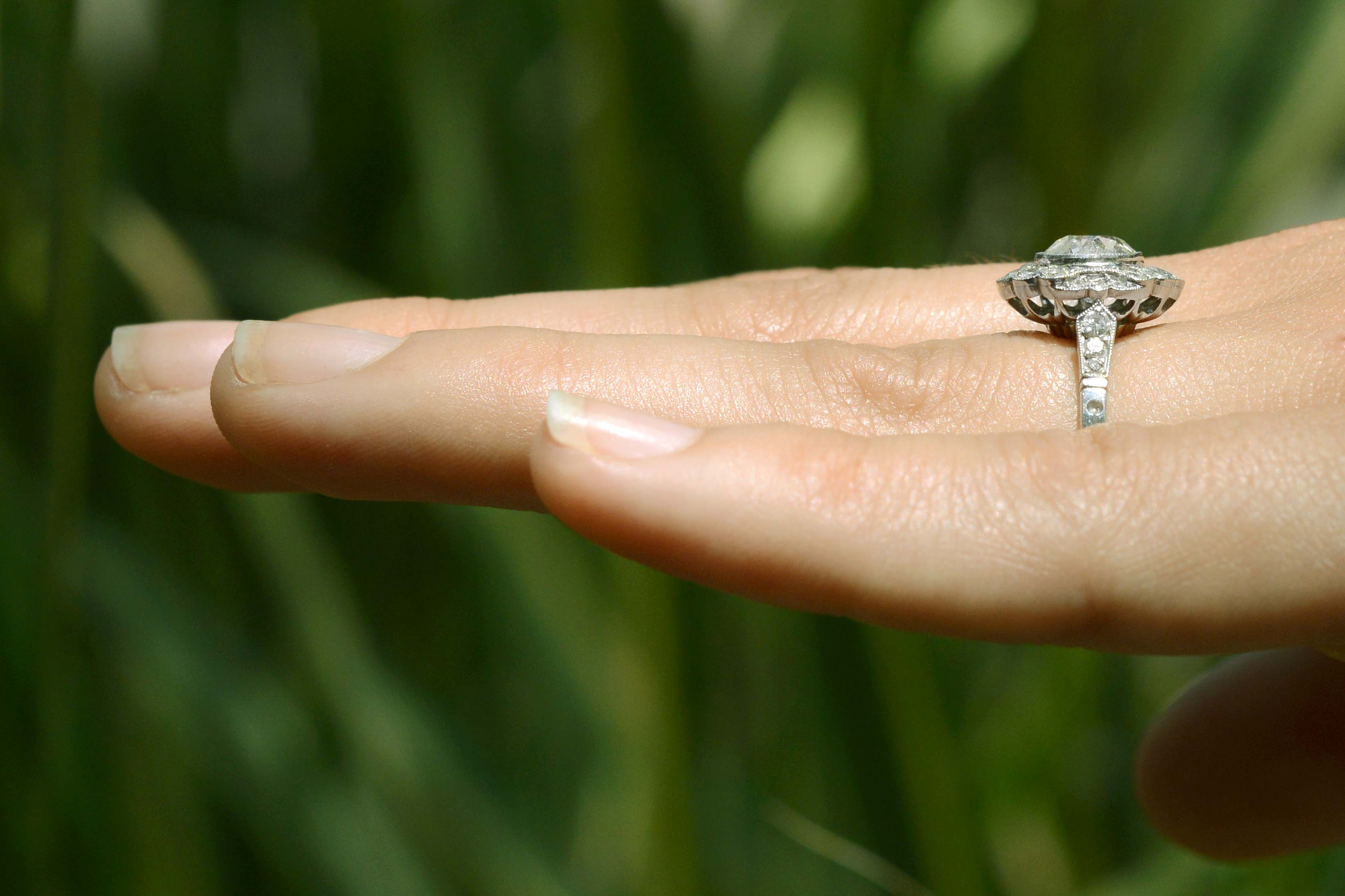 This engagement ring has diamonds on the band.