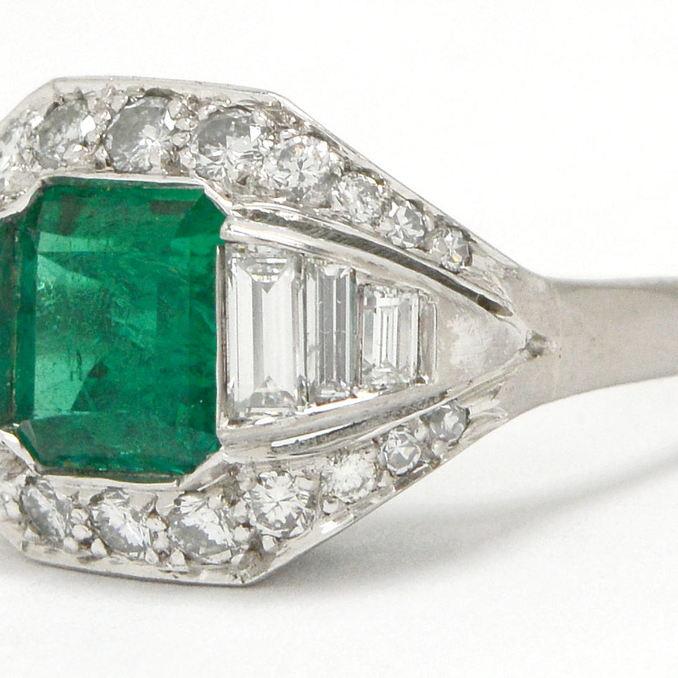 Step cut emerald and diamonds square Art Deco ring.