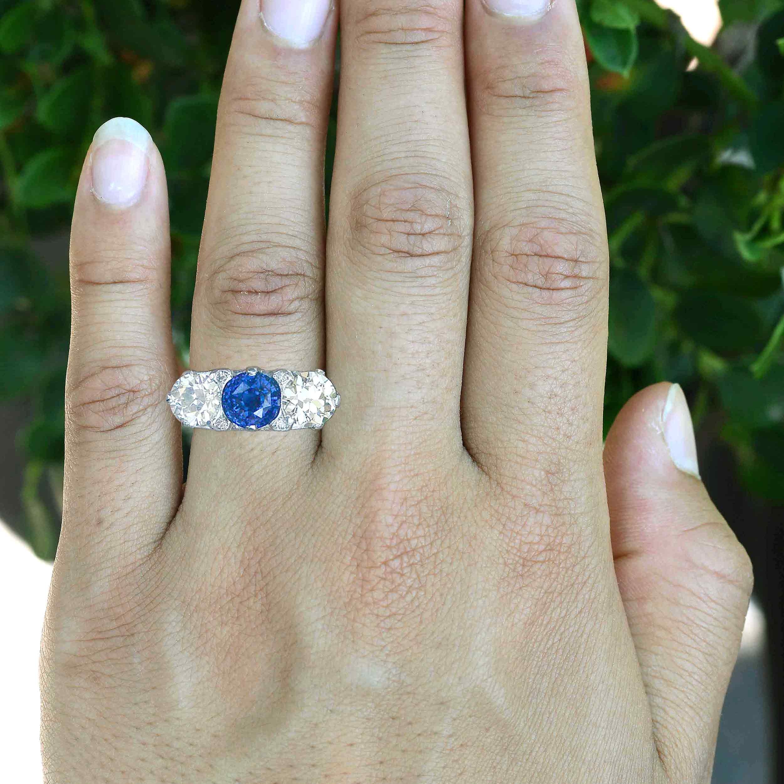 3 carat blue sapphire three stone engagement ring.