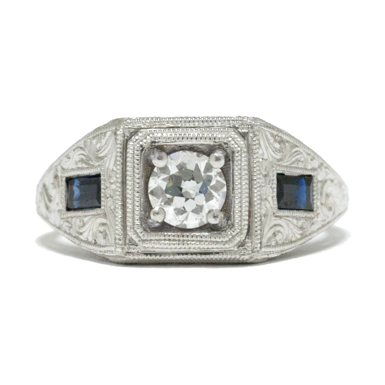 3 stone diamond wedding ring with 2 side sapphires.