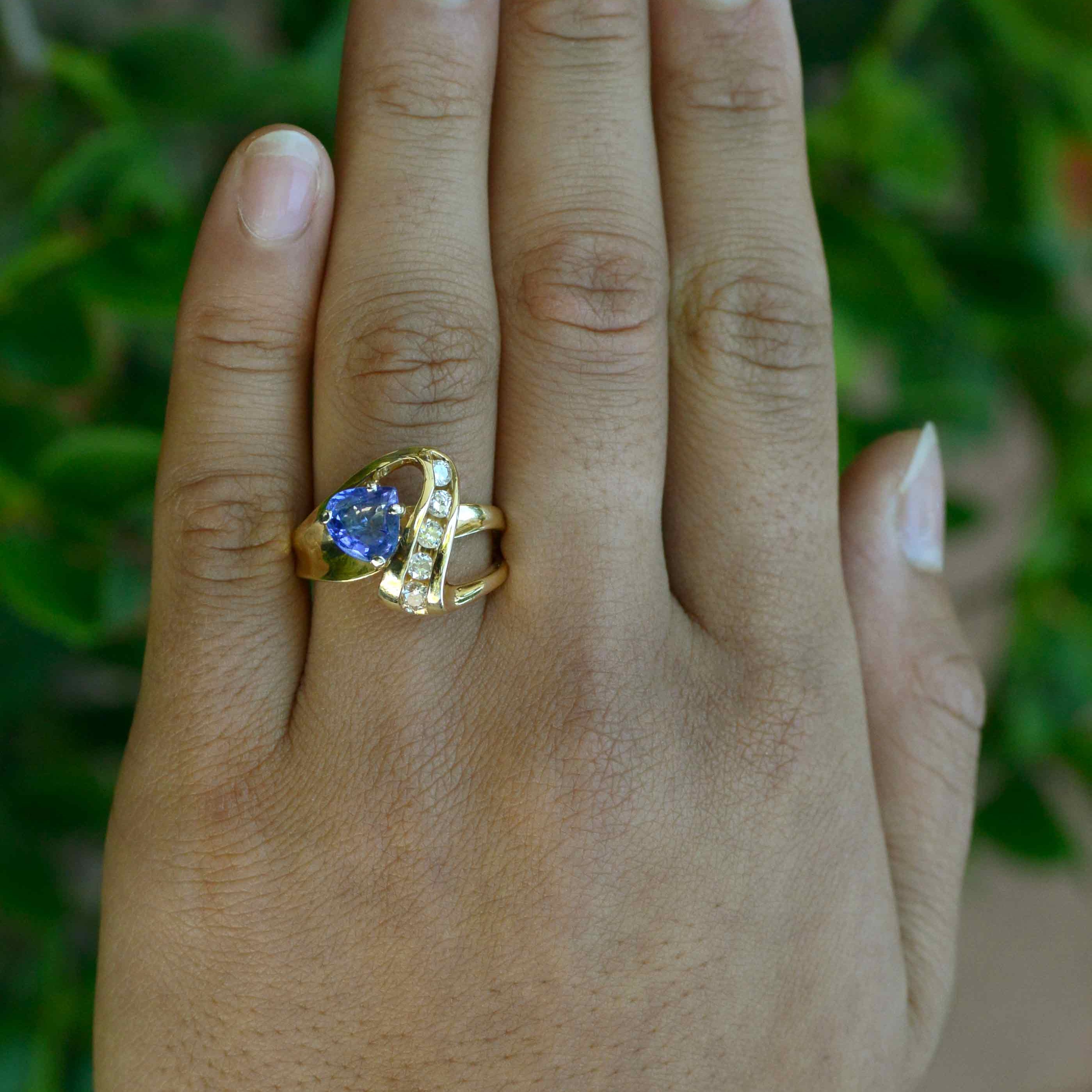 A natural triangle shape tanzanite and diamonds cocktail ring.