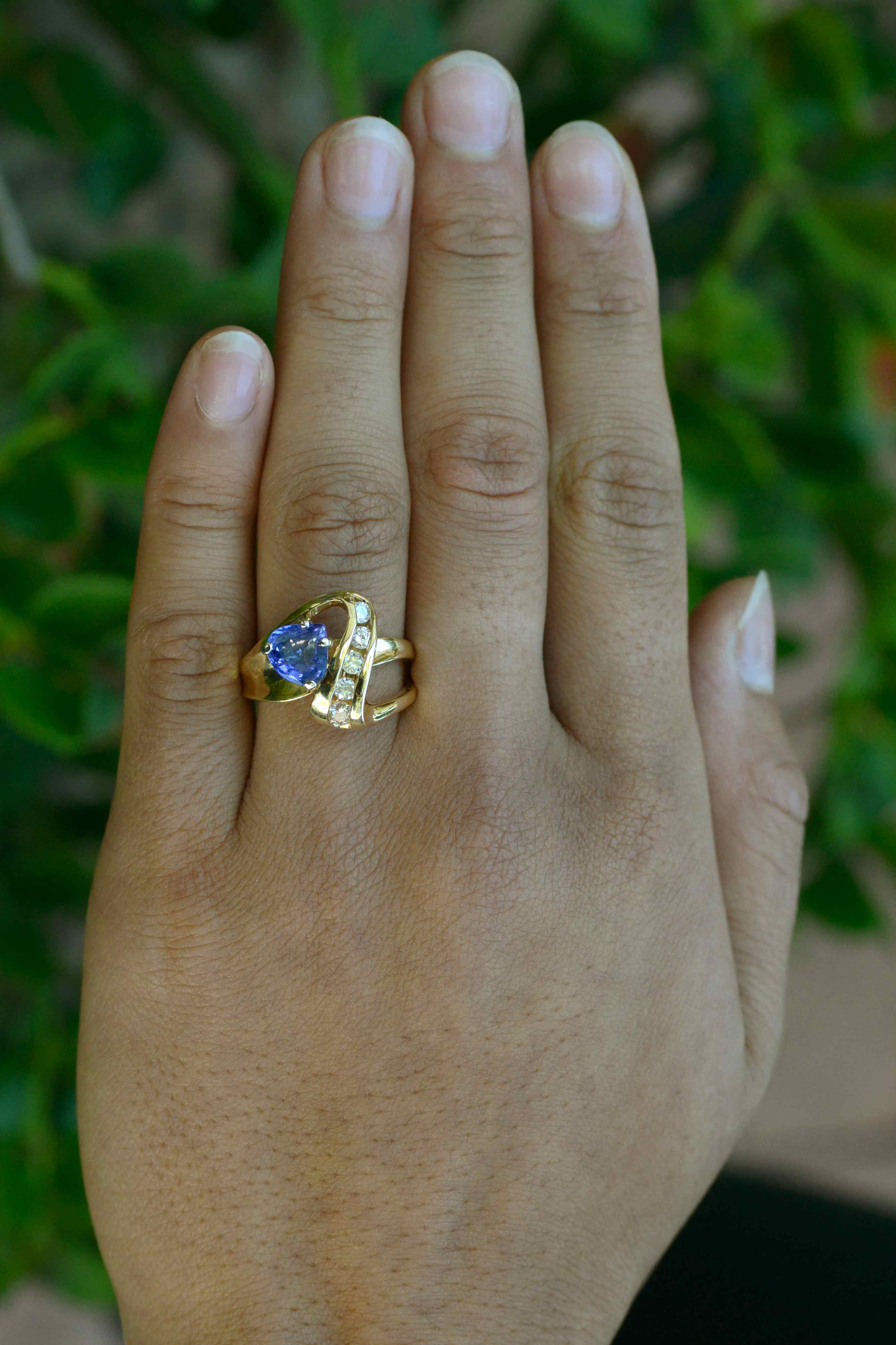 A natural triangle shape tanzanite and diamonds cocktail ring.