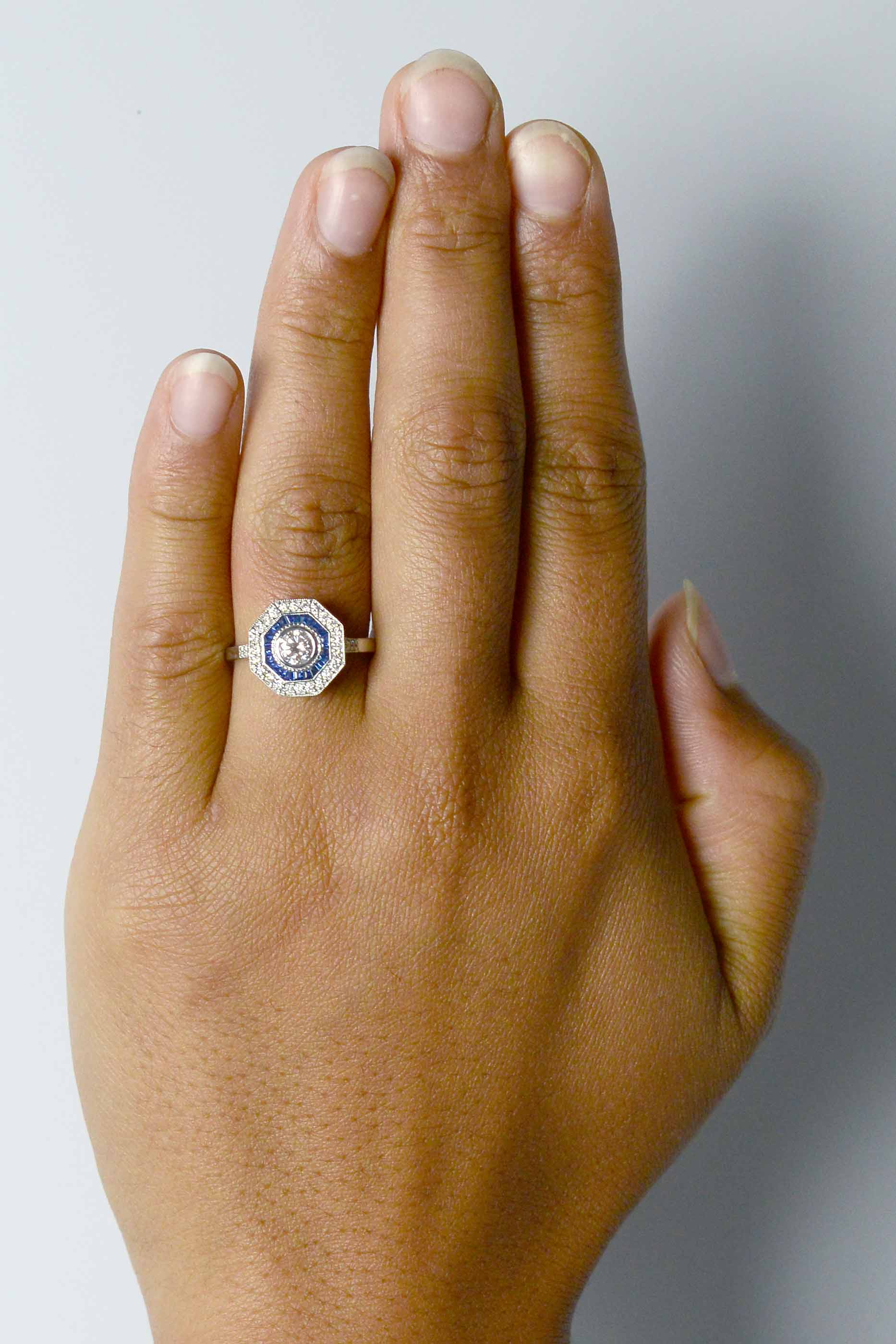 Diamond engagement ring with a pink tone.