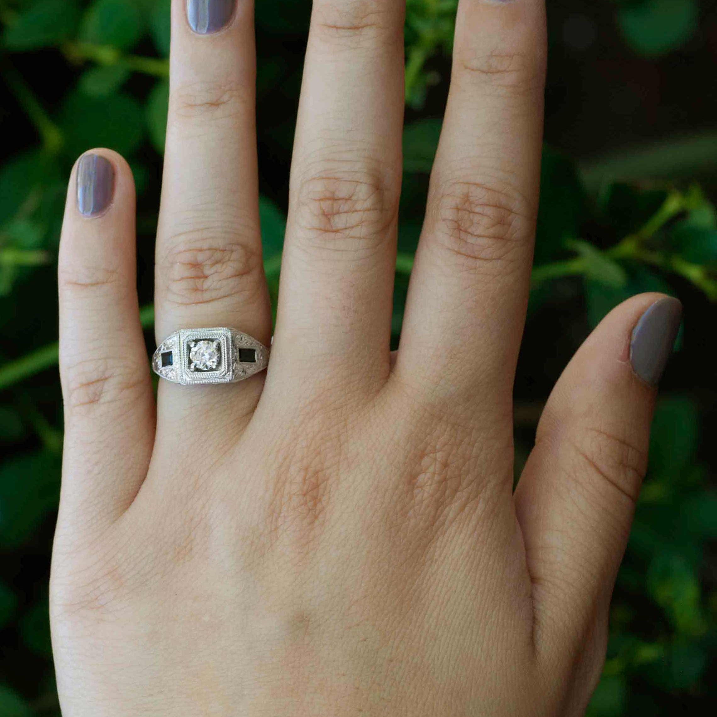 A unique three stone diamond sapphire wedding ring.