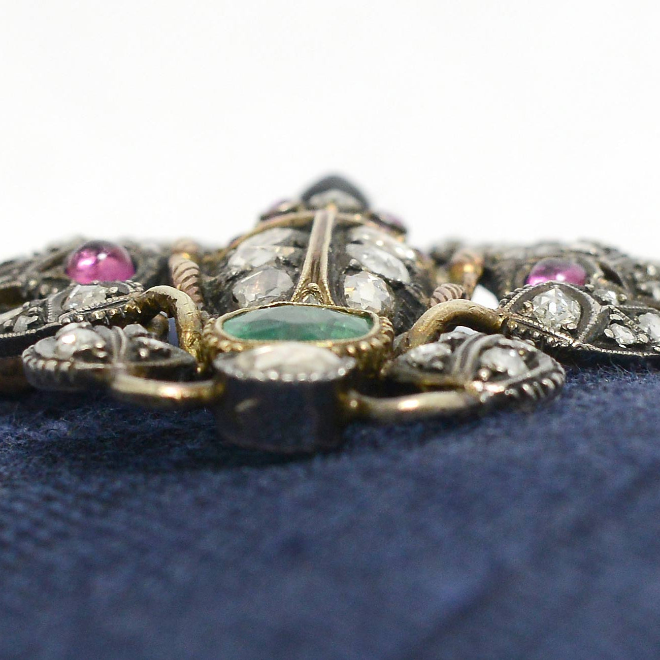 A diamond, ruby, sapphire and emerald scrab beetle brooch.
