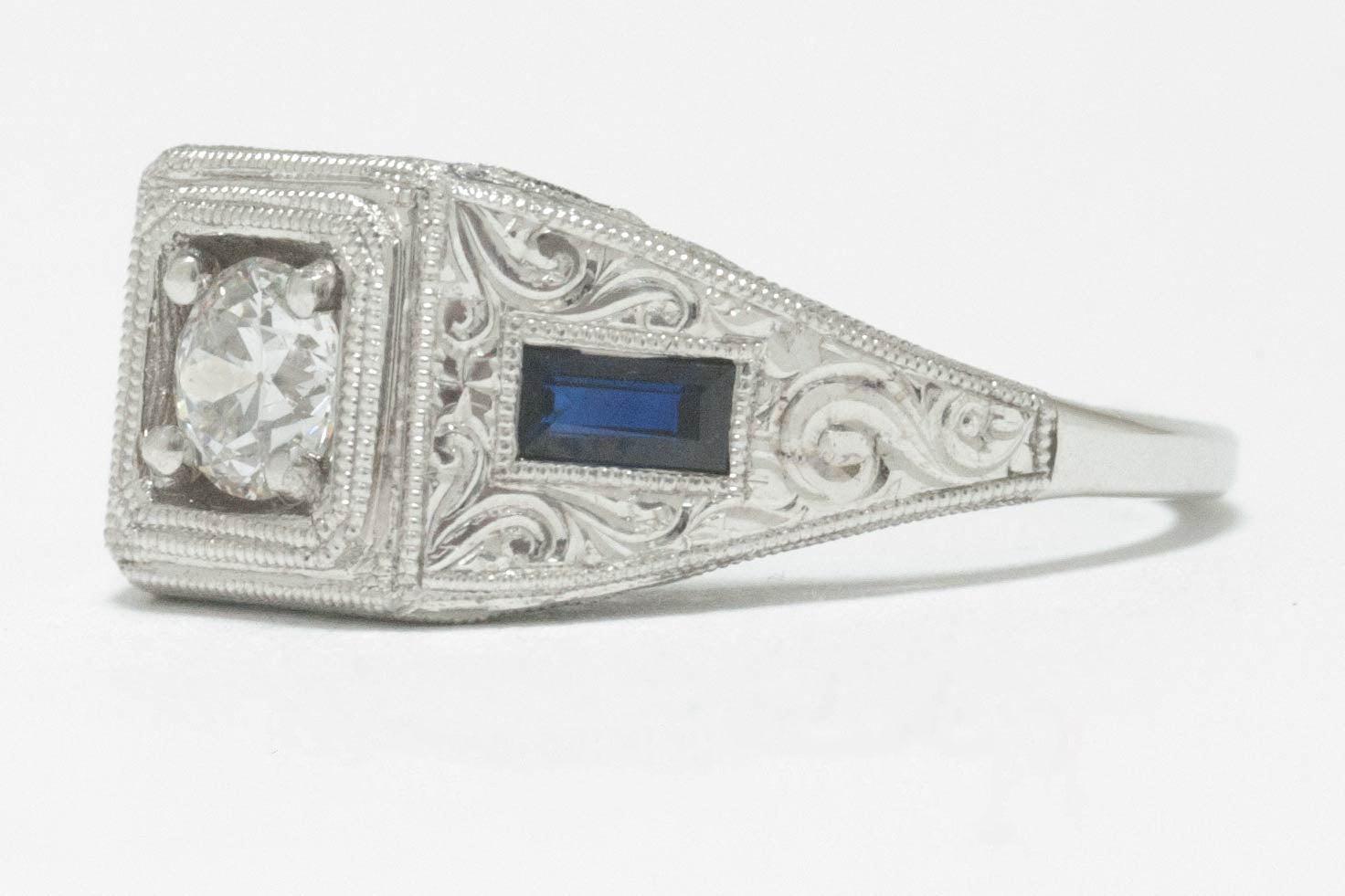 A natural old European diamond engagement ring with blue sapphires.