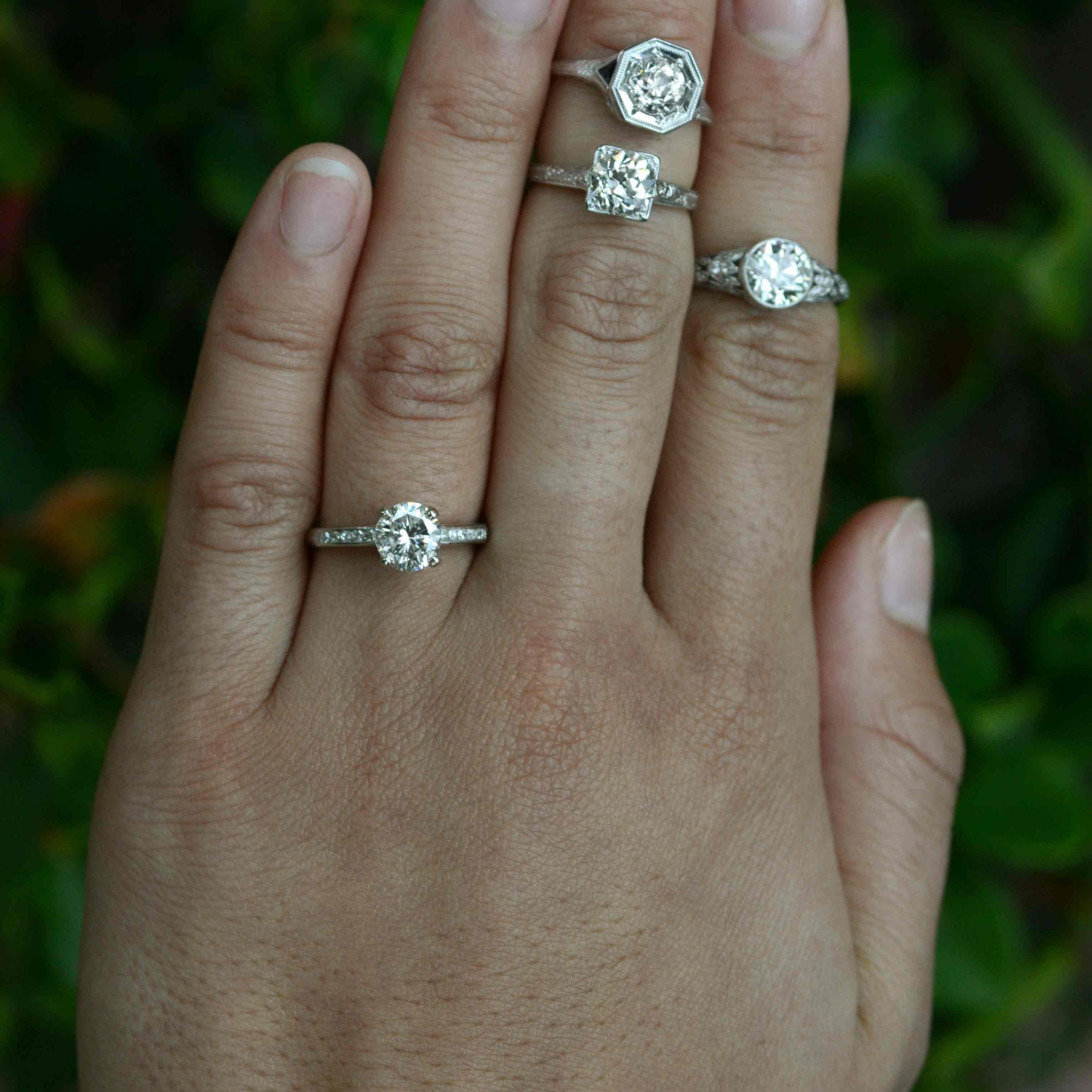 Vintage diamond platinum solitaire engagement rings.