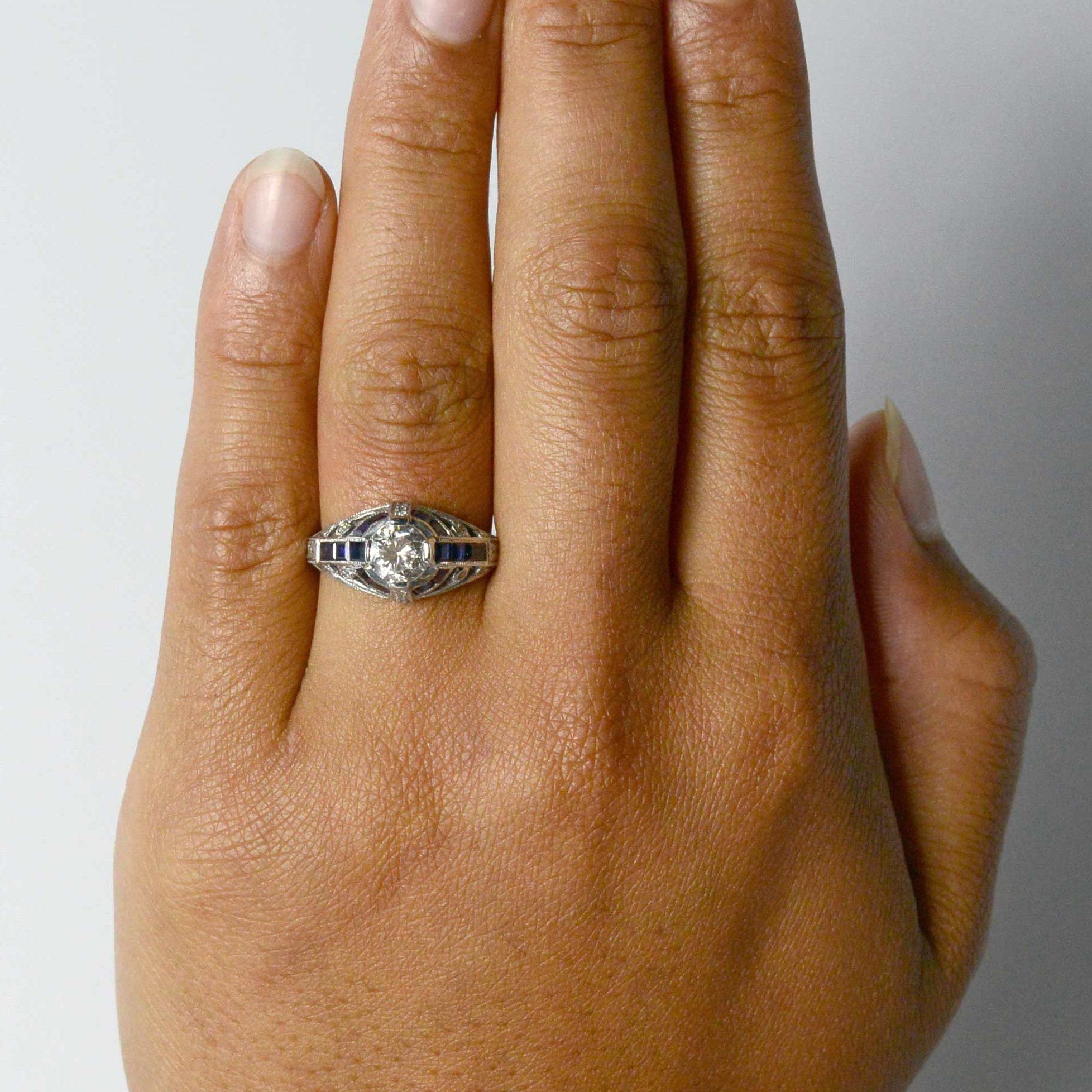 1 carat diamond Art Deco engagment ring with blue sapphires.