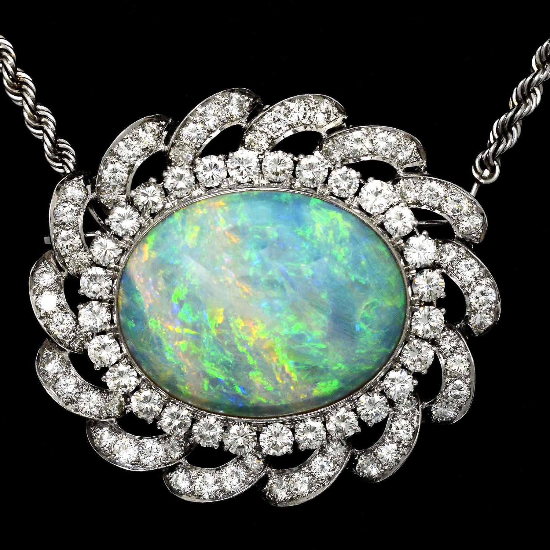 A 30 carat oval opal, white gold diamond halo pendant necklace.