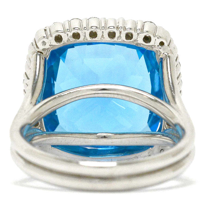 A vivid, swiss blue topaz in a 14k white gold ring setting.