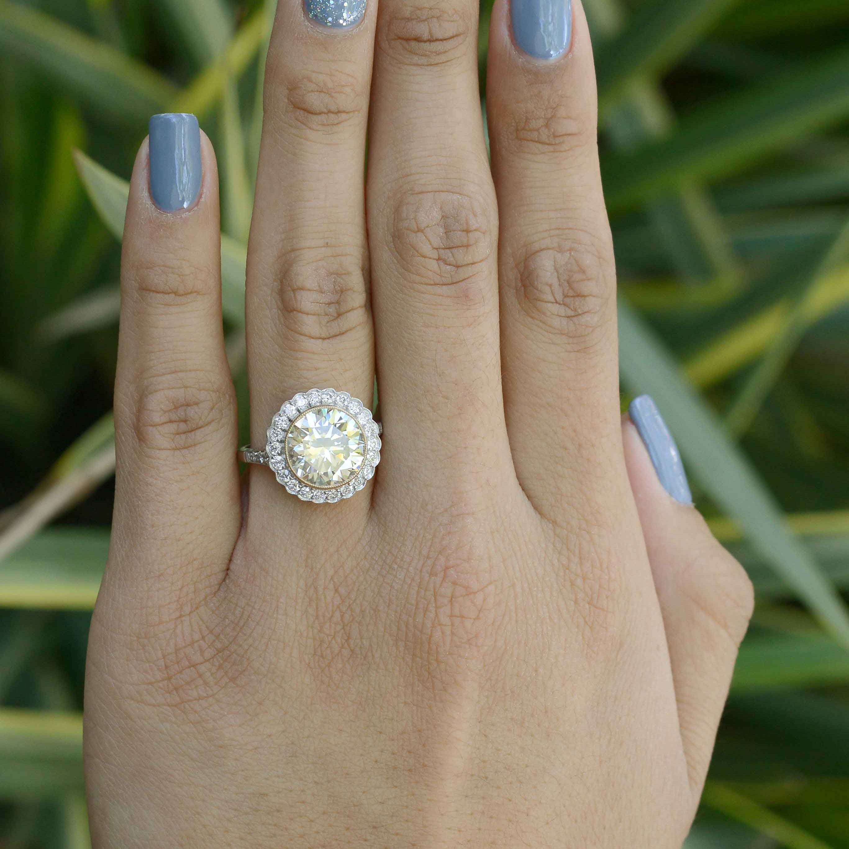 A huge diamond solitaire surrounded by a scalloped halo.