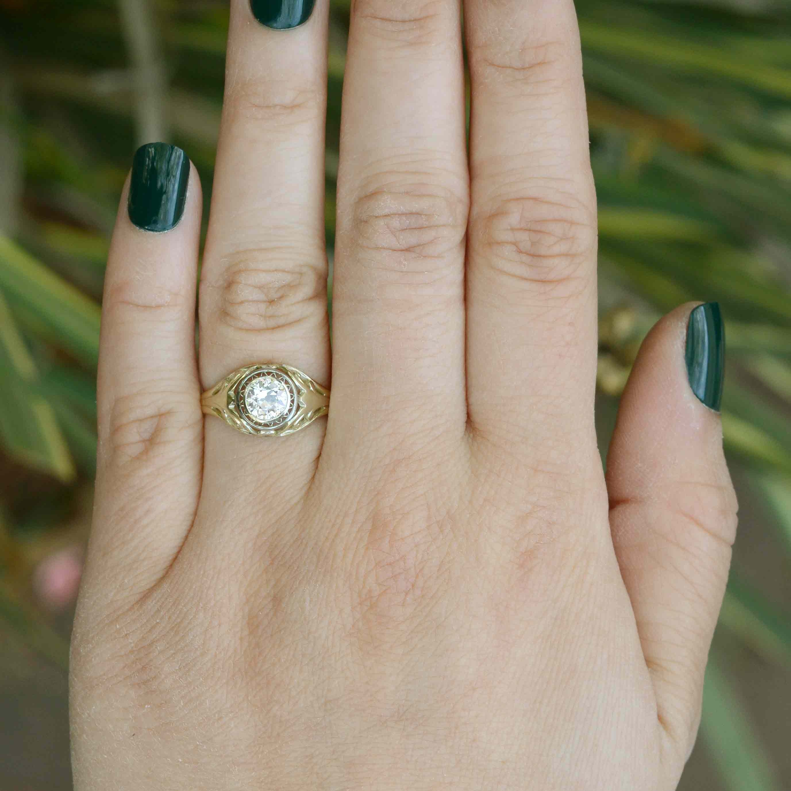 An old mine brilliant diamond of over a half carat, set in a unique antique engagement ring.