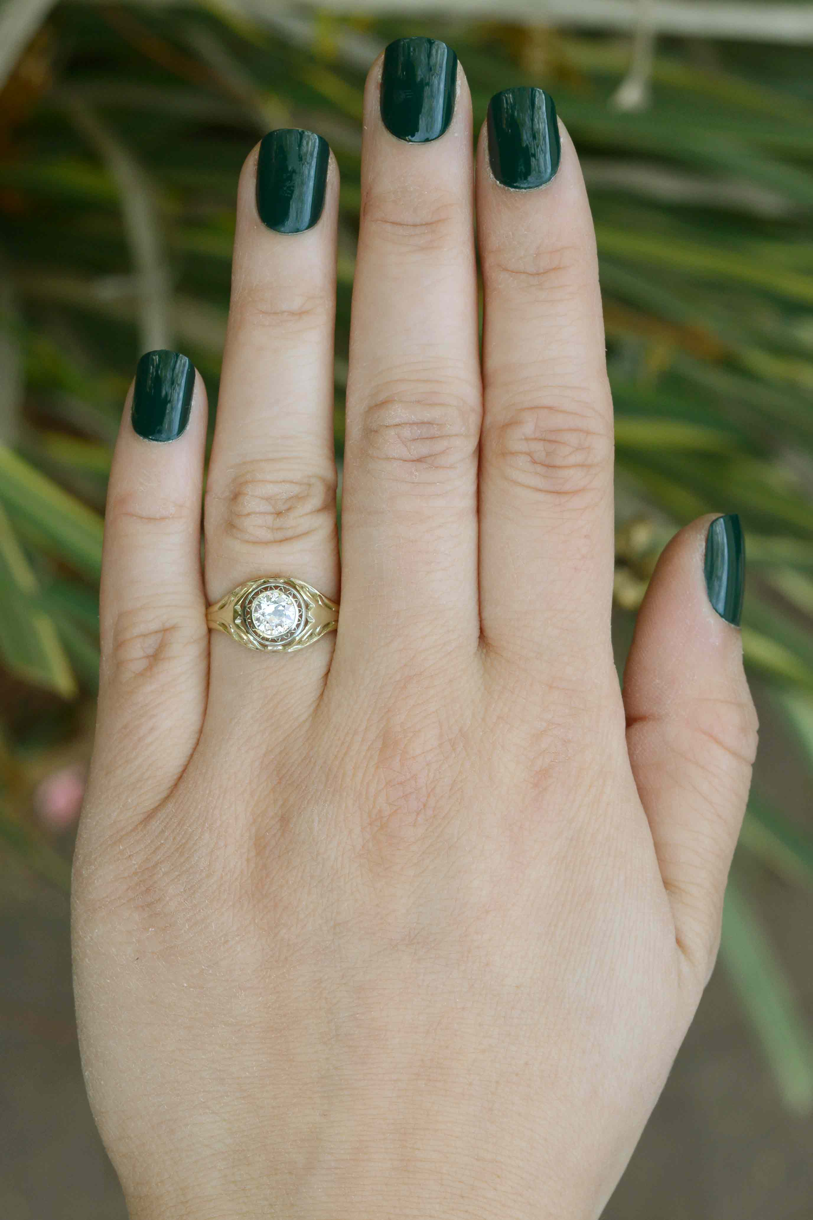 An old mine brilliant diamond of over a half carat, set in a unique antique engagement ring.
