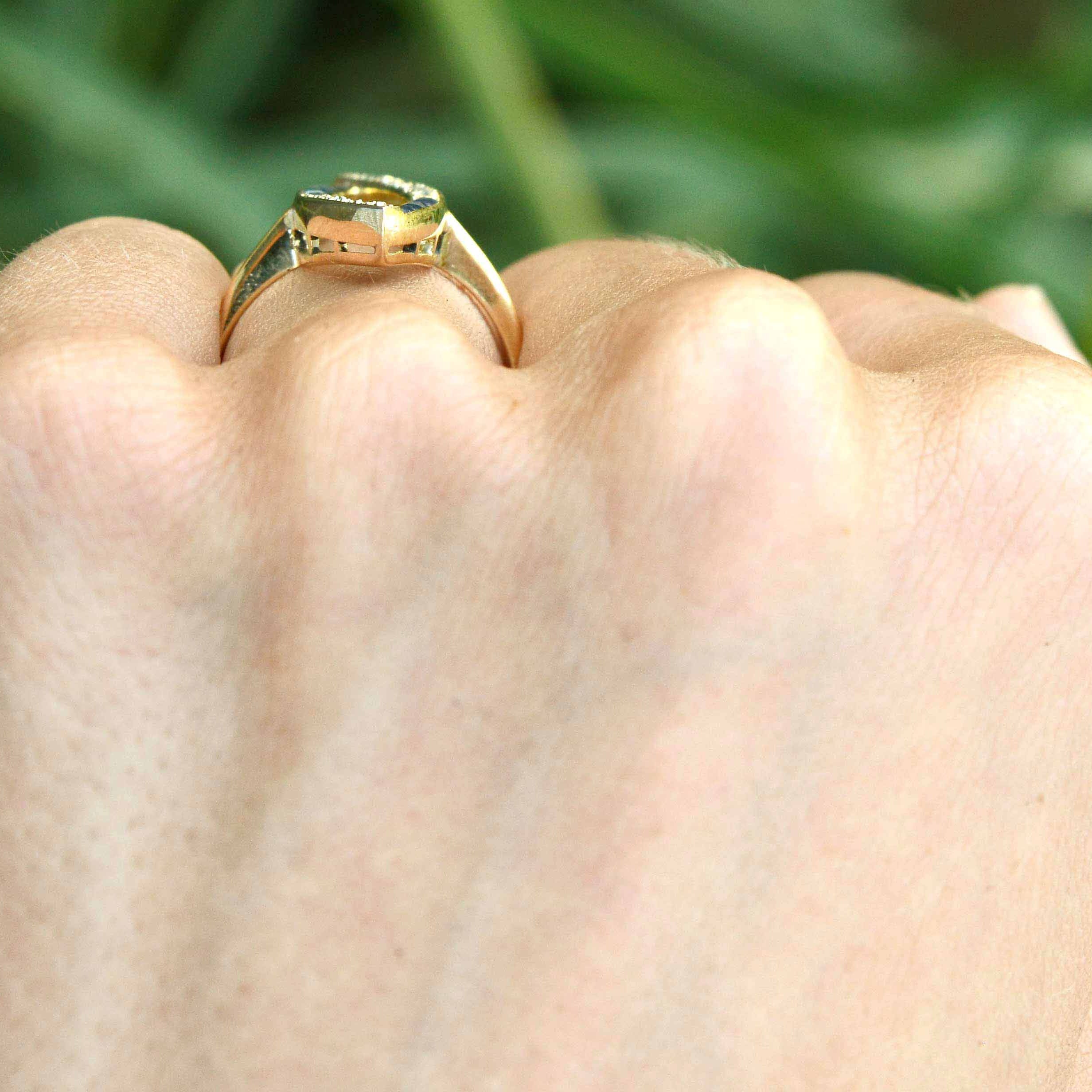 A long, 18k yellow gold navette shaped statement ring.