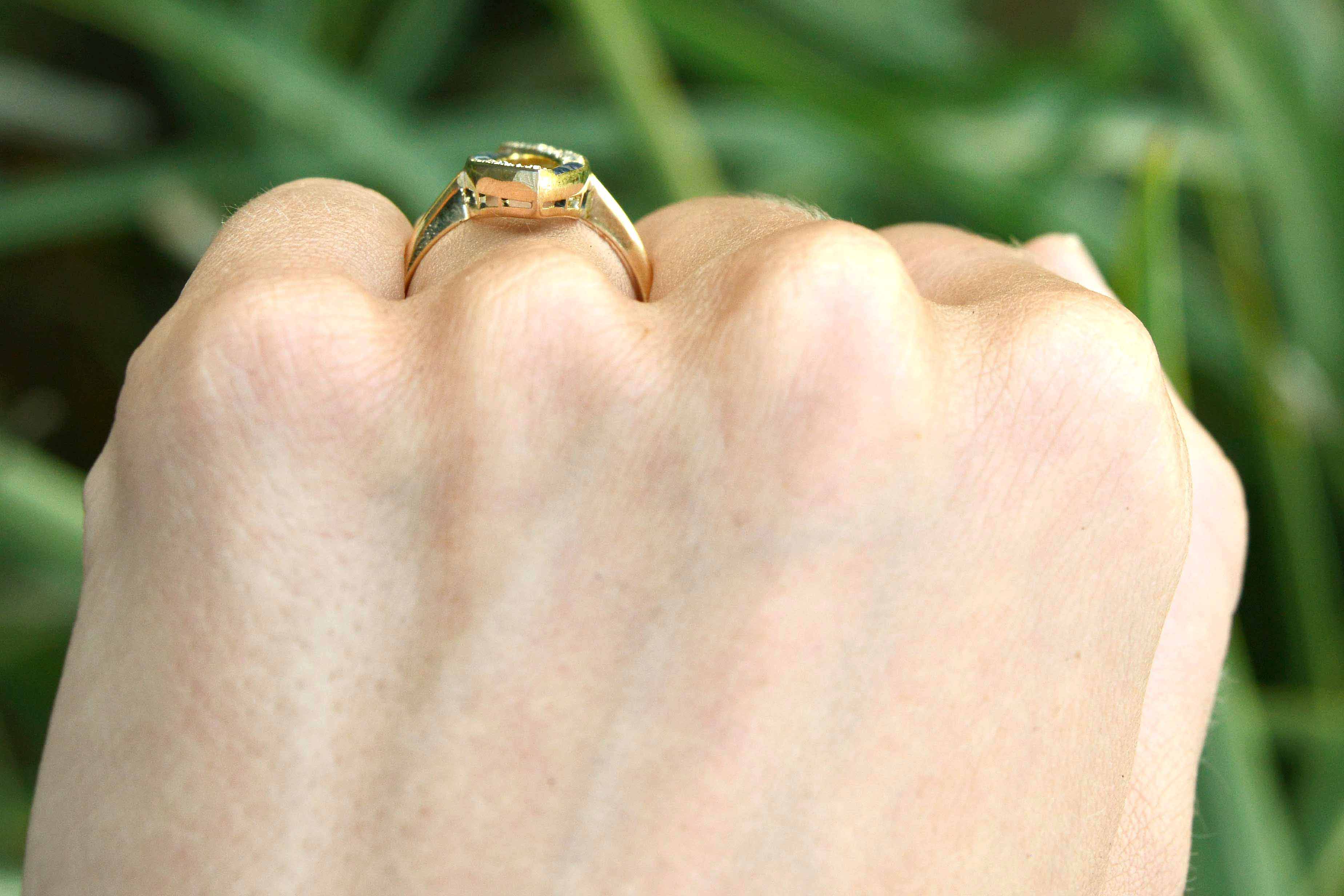 A long, 18k yellow gold navette shaped statement ring.
