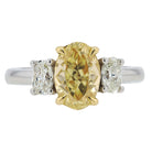 GIA 1.50 Carat Fancy Yellow Oval Diamond 3 Stone Platinum Engagement Ring