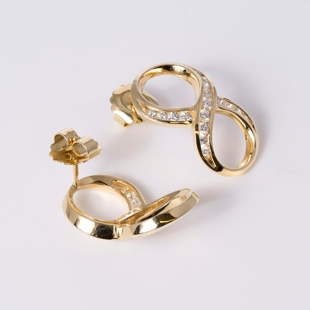 1980s Mid-Mod Bold 14k Yellow Gold Diamond Infinity Earrings