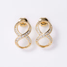 1980s Mid-Mod Bold 14k Yellow Gold Diamond Infinity Earrings