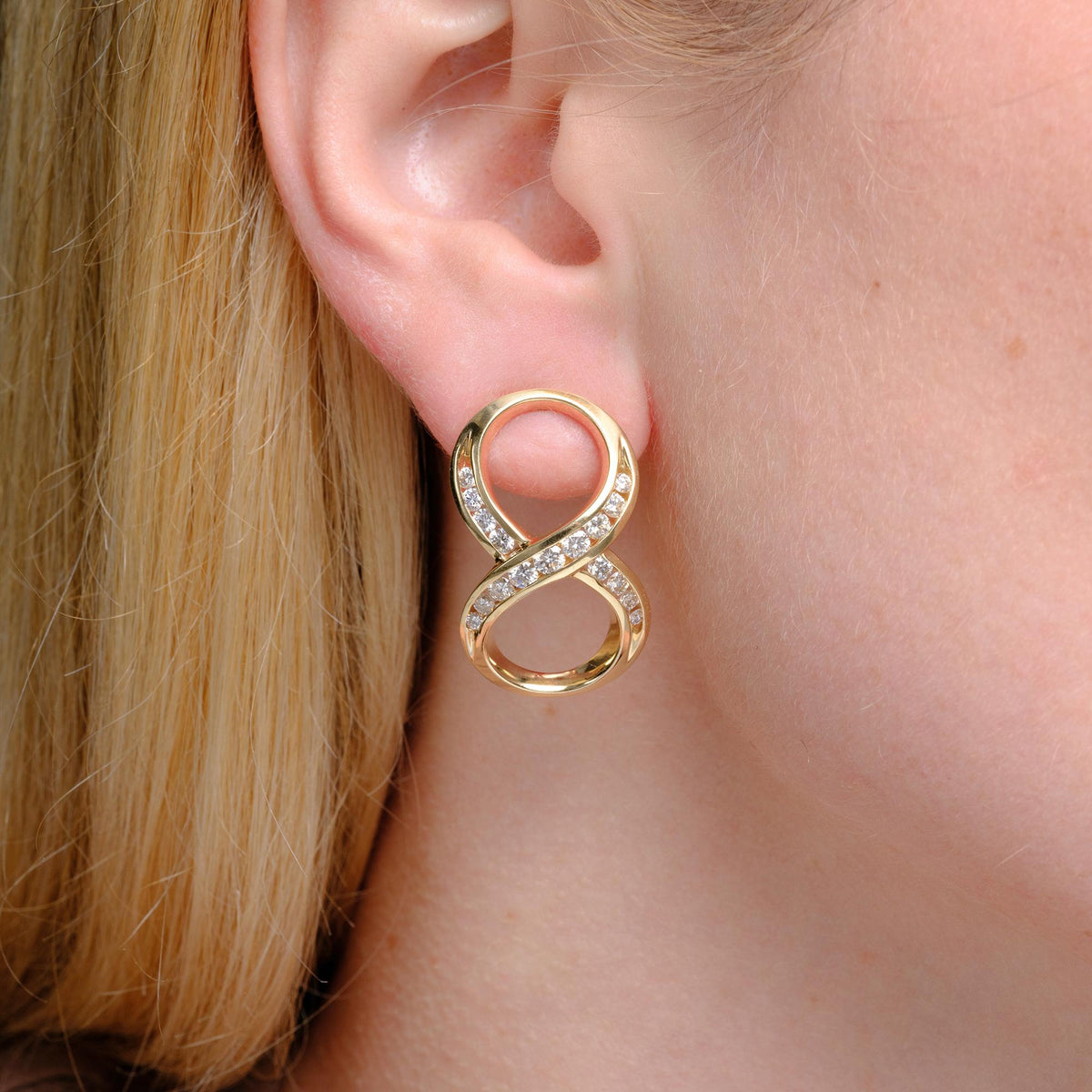 1980s Mid-Mod Bold 14k Yellow Gold Diamond Infinity Earrings
