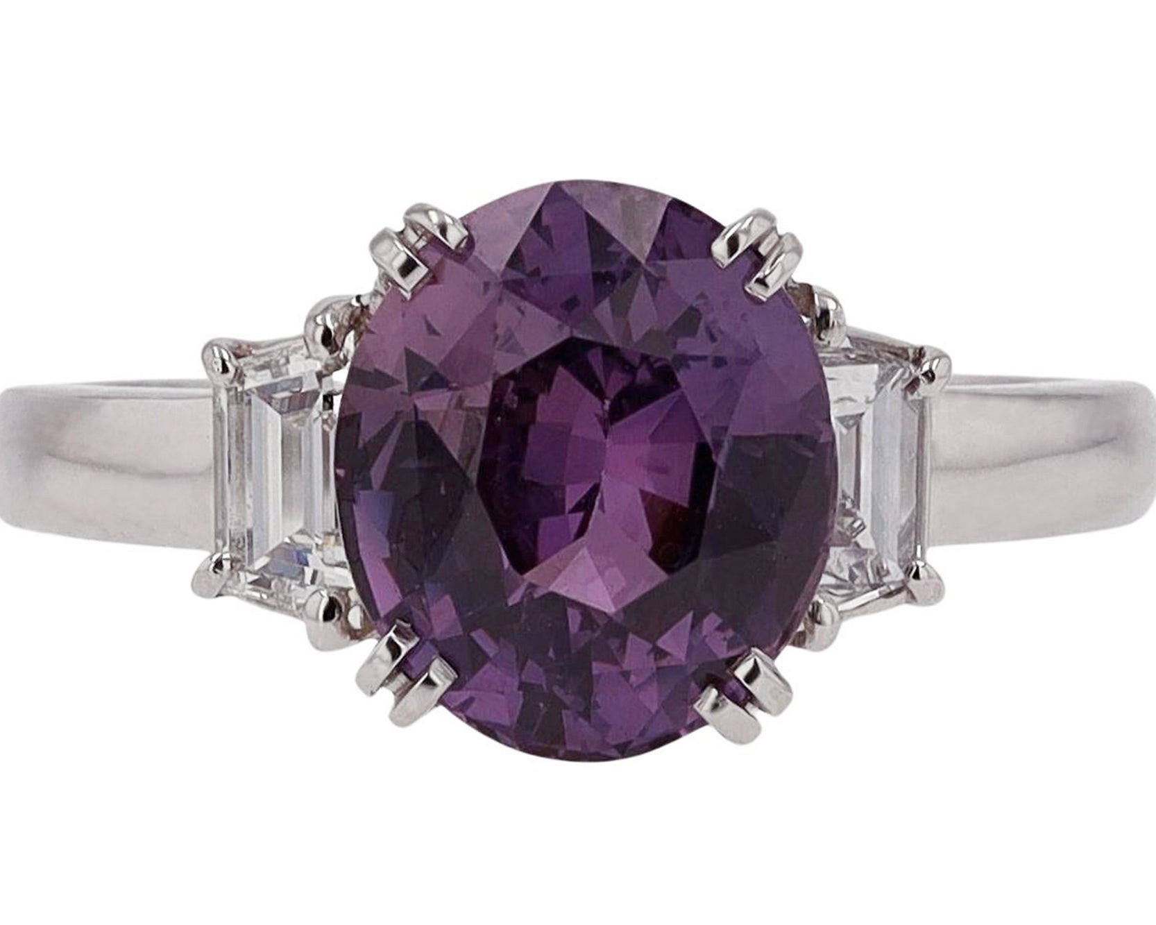 Three carat oval purple sapphire diamond 3 stone engagement ring.