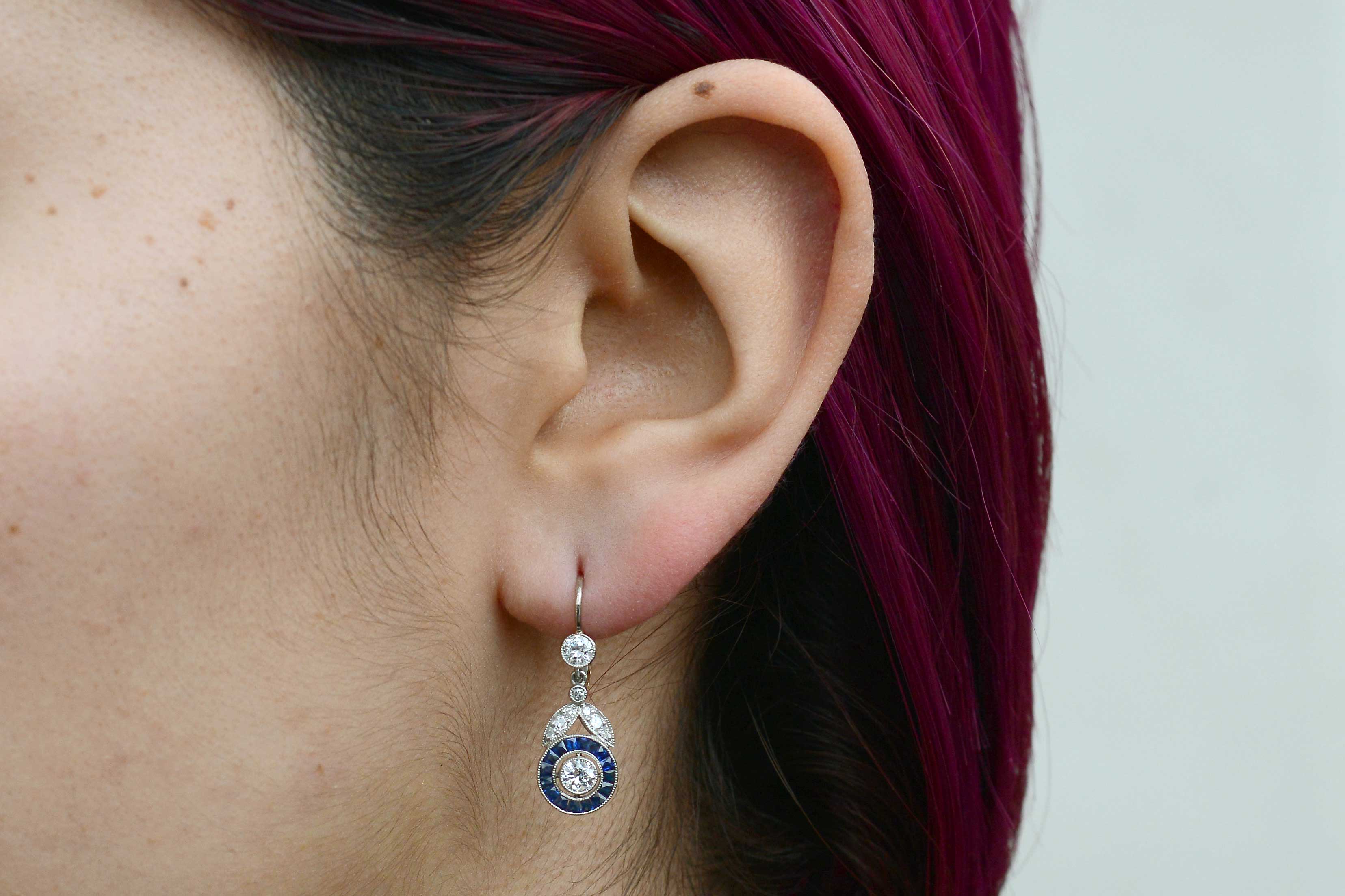 These dangle earrings really capture the light with brilliant, sparkling old cut diamonds.