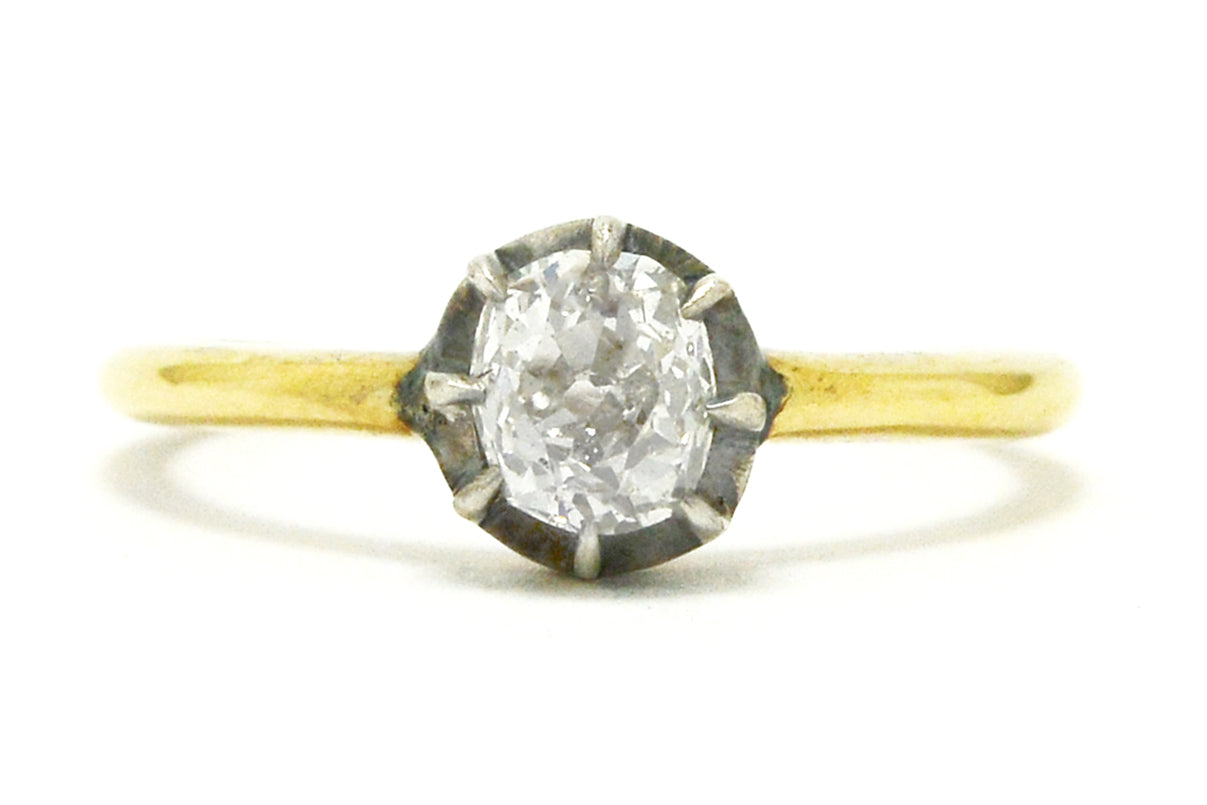 A silver and yellow gold Georgian style diamond solitaire ring.