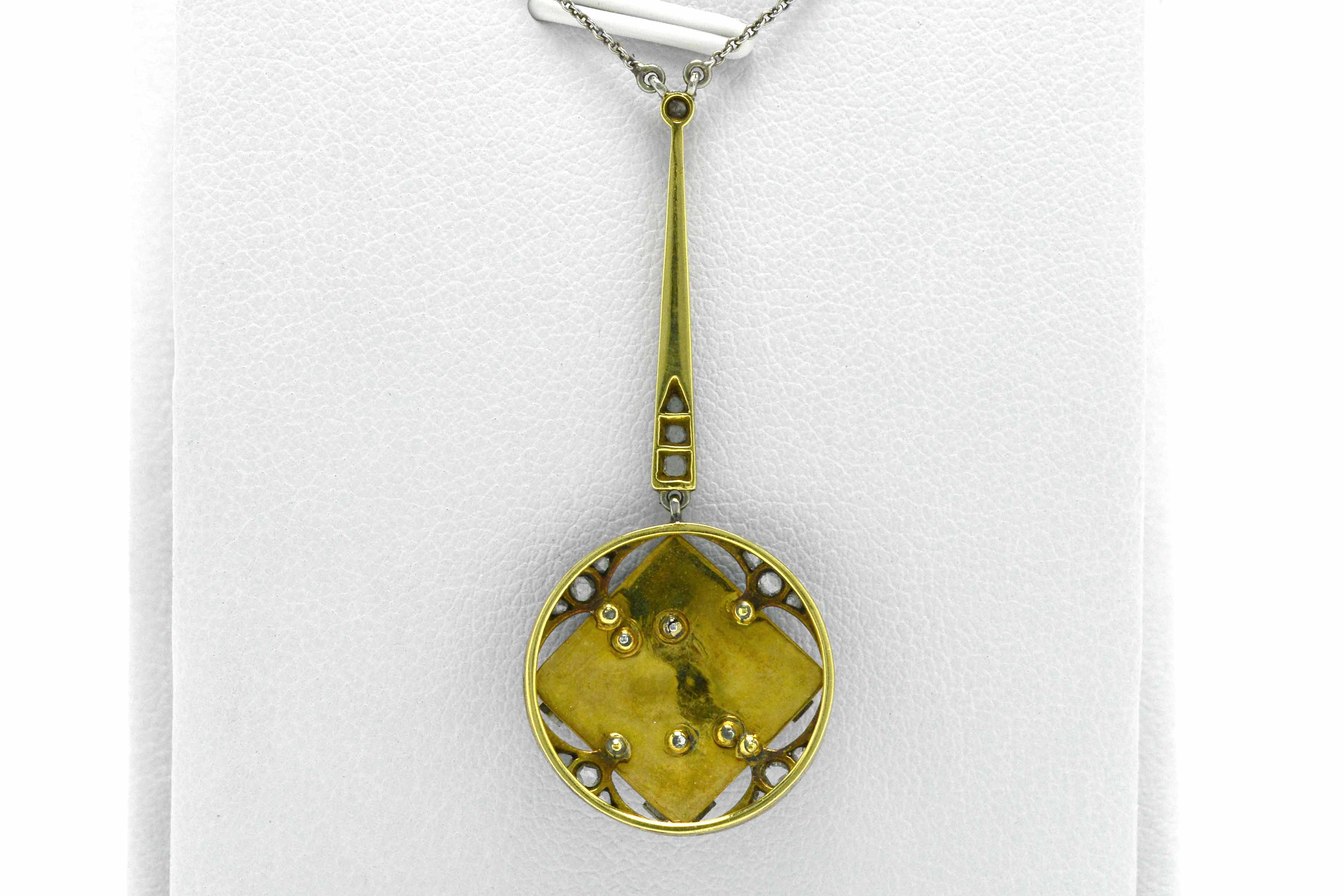 A gold back and platinum top Edwardian antique pendant necklace.