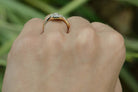 Two diamonds set in a yellow and white gold ring.